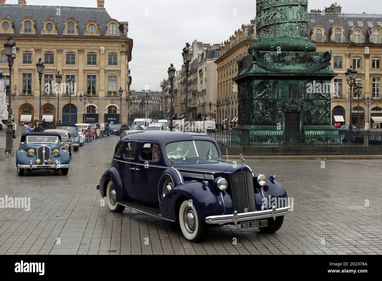 A Vintage 1939 Blue Packard Drives Through The Place Vendome In Paris December 9 2009 French Car Enthusiasts Associated Through The Paris Based Classic Rent Company Offers Classic Luxury Cars For Rental For