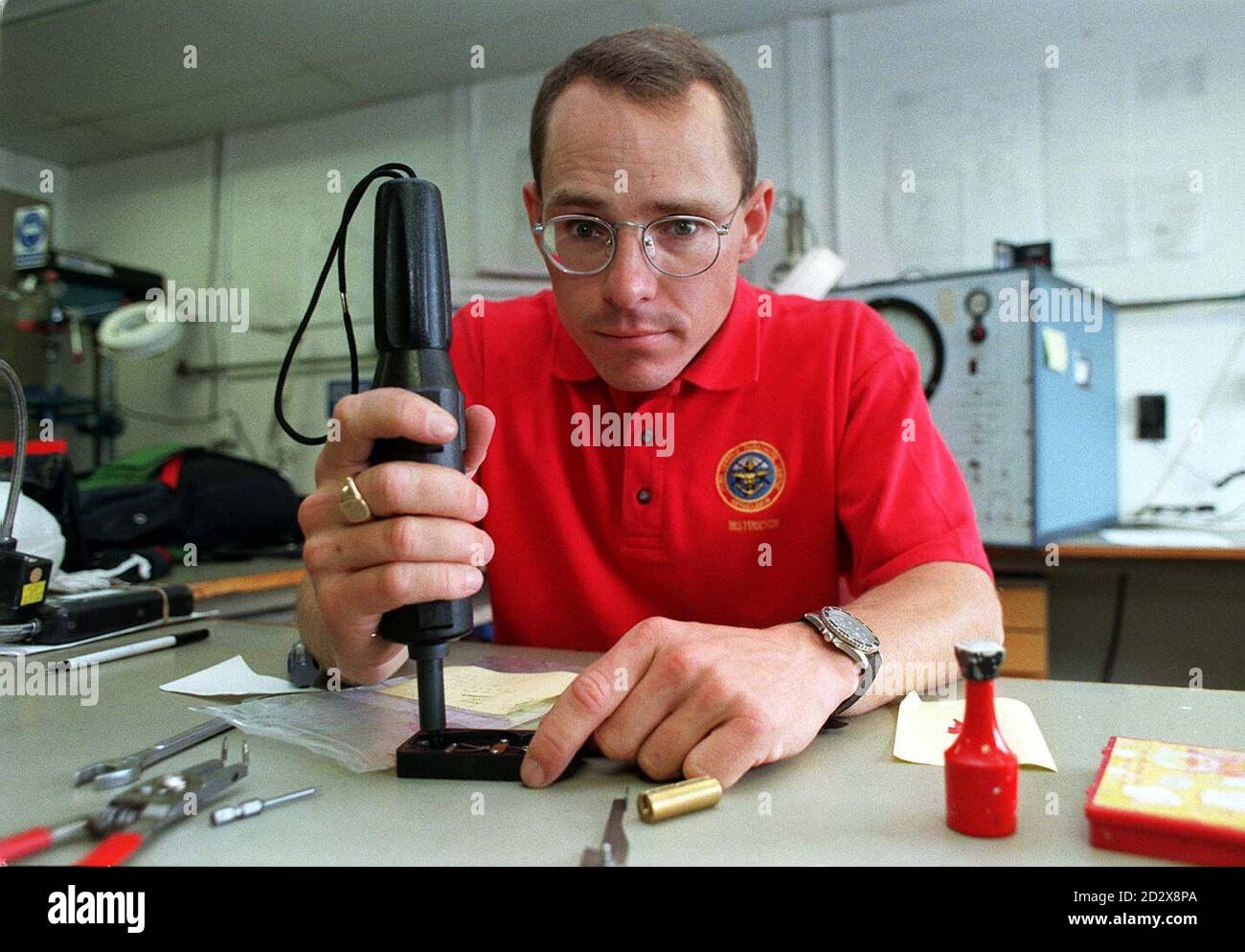 Parachute Instructor/engineer Dave Ballard, works on one of the new