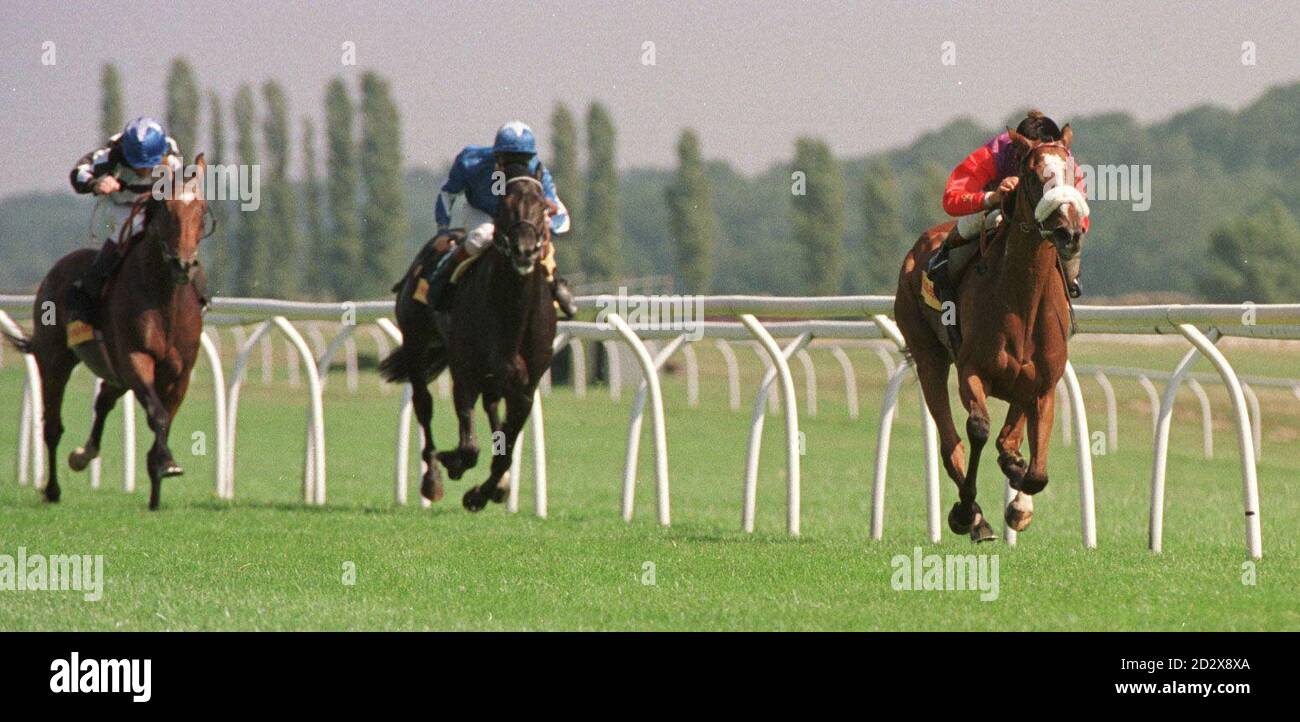 Phantom Gold, with Frankie Dettori on top, winning the Triple Print Geoffrey Freer Stakes at Newbury today (Saturday) from Posidonas, Richard Quinn up, in second place (centre) and Song Of Tara, left, John Ried up, in third place. Photograph by Fiona Hanson. Stock Photo