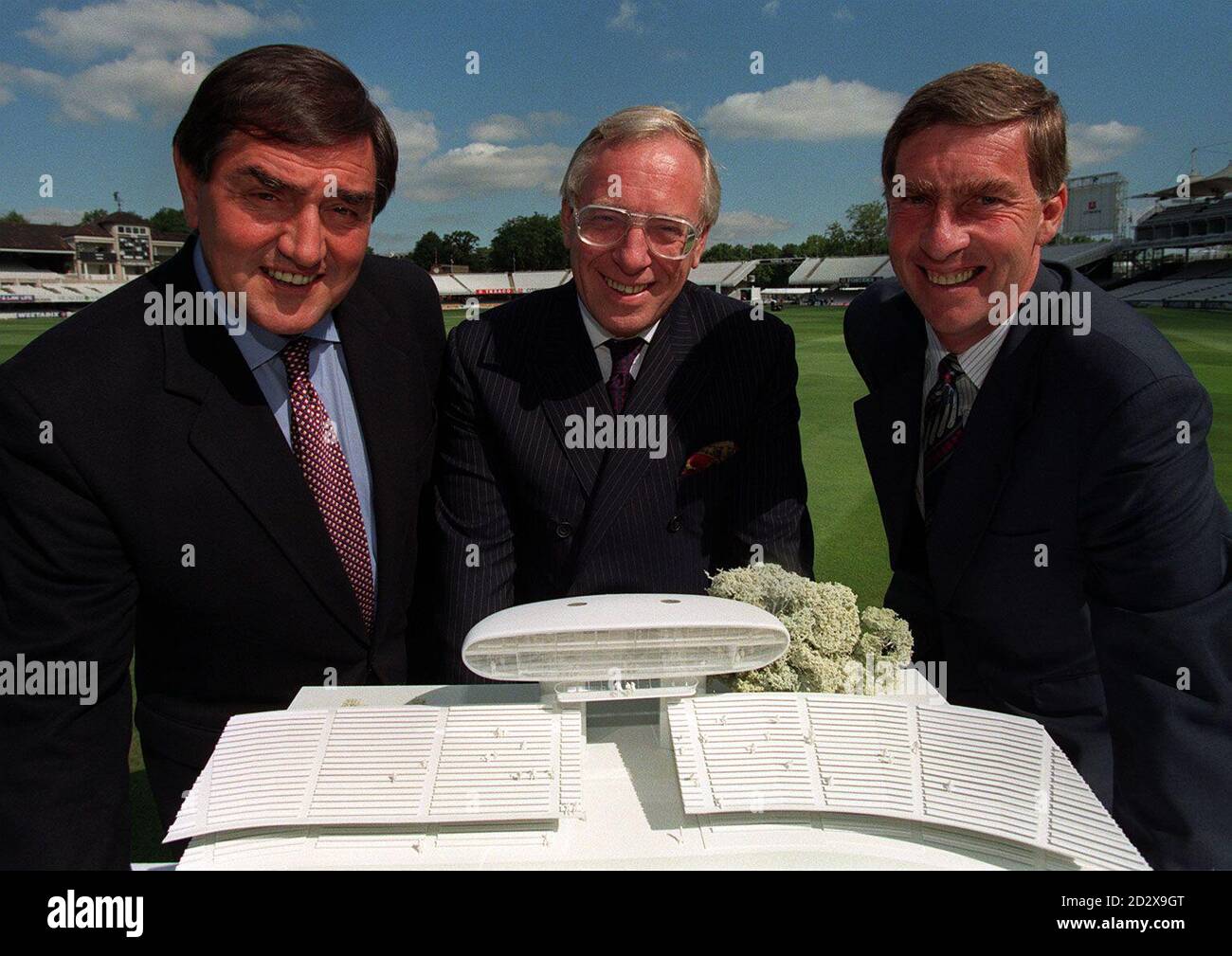 Tony Lewis (left), Martin Gray (centre) Cheif Executive of NatWest UK and Tony Lewis (right) Secretary of MCC with the model of the new media centre to be built at Lords with the help of a  2.6 million Investment by NatWest. PA Picture by Michael Crabtree Stock Photo