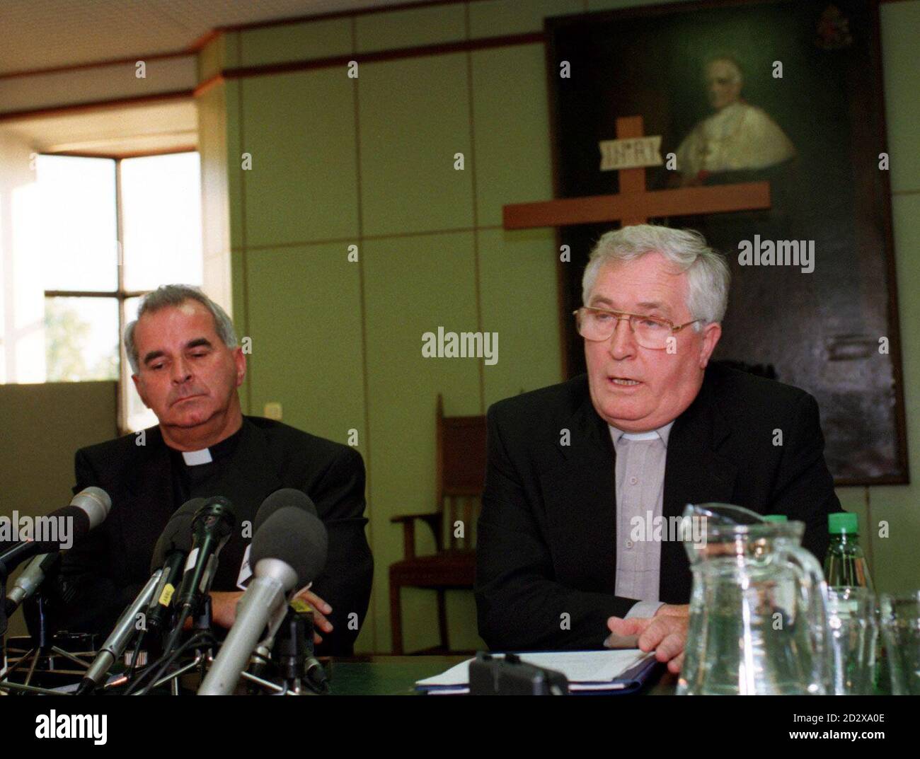 Cardinal Thomas Winning (right) explains the circumstances of the resignation of Runaway Roman Catholic bishop Roderick Wright during a news conference in Glasgow tonight (Monday). Archbishop Keith O'Brien, (left) who has taken over the temporary running of Bishop Wright's diocese of Argyll and the Isles, was also present. See PA Story MISSING Bishop. PA Photos. Stock Photo