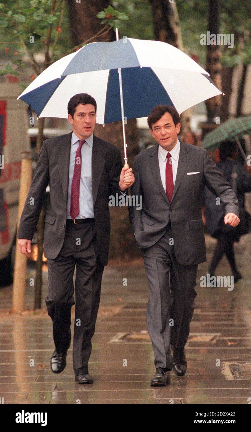 Kevin (left) and Ian Maxwell, sons of publishing magnate Robert Maxwell, arrive at the High Court in London today (Thursday), where a judge ruled Kevin Maxwell will not stand trial a second time on charges relating to the collapse of the disgraced tycoon's media empire. See PA story COURTS Maxwell. Photo by Stefan Rousseau/PA Stock Photo