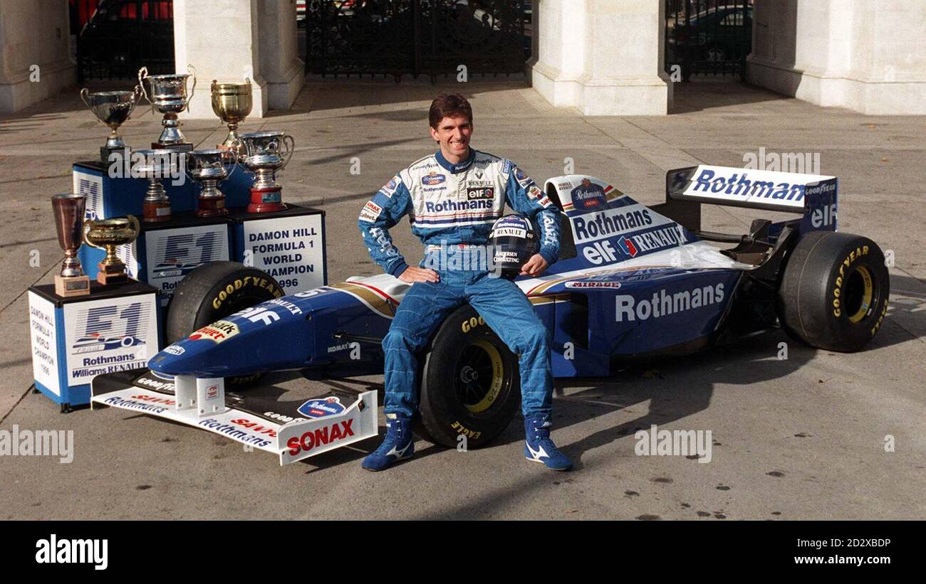Formula One motor racing champion Damon Hill perches on the side of Williams F1 car, surrounded by trophies, at Marble Arch in London today (Weds),  following his return from Tokyo after clinching the title last Sunday. Photo by Michael Stephens. Stock Photo