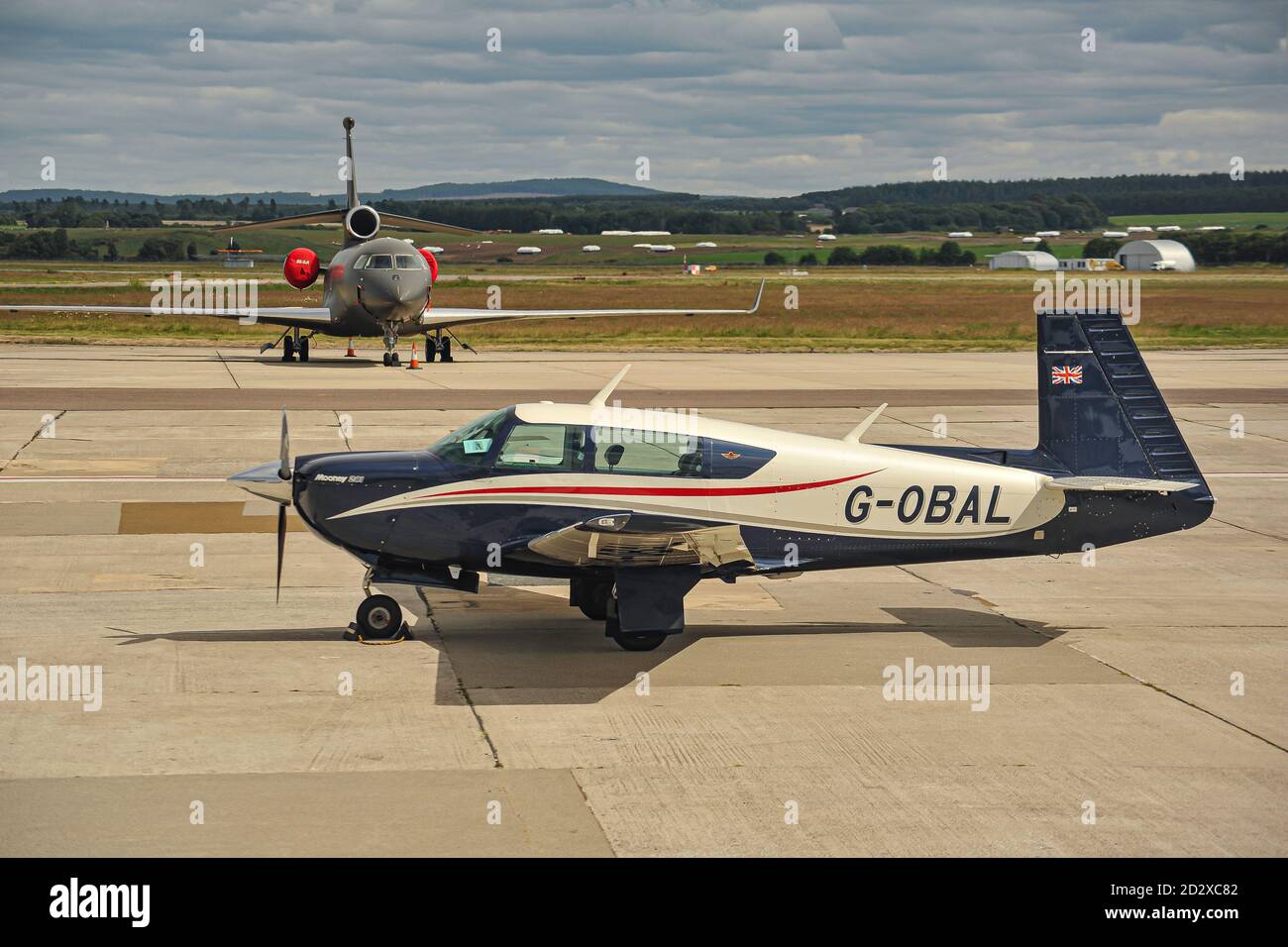 A Mooney M20J on a stop over at Inverness airport Scotland. Stock Photo