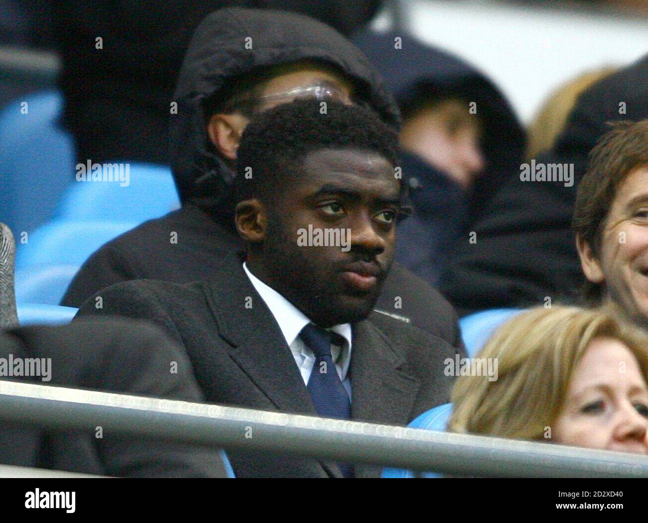 Manchester City's Kolo Toure in the stands Stock Photo - Alamy