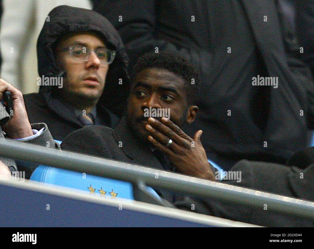 Manchester City's Kolo Toure in the stands Stock Photo - Alamy