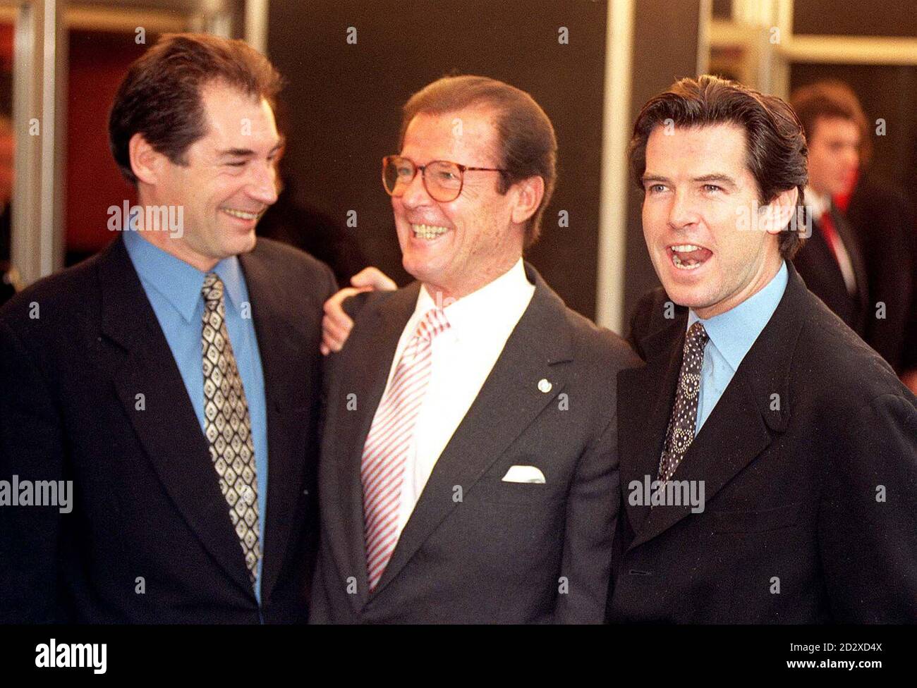 James Bond actors (from left) Timothy Dalton, Roger Moore and Pierce Brosnan arrive for today's (Sunday) memorial service for film producer Albert 'Cubby' Broccoli, at the Odeon, Leicester Square. Photo by Fiona Hanson/PA Stock Photo