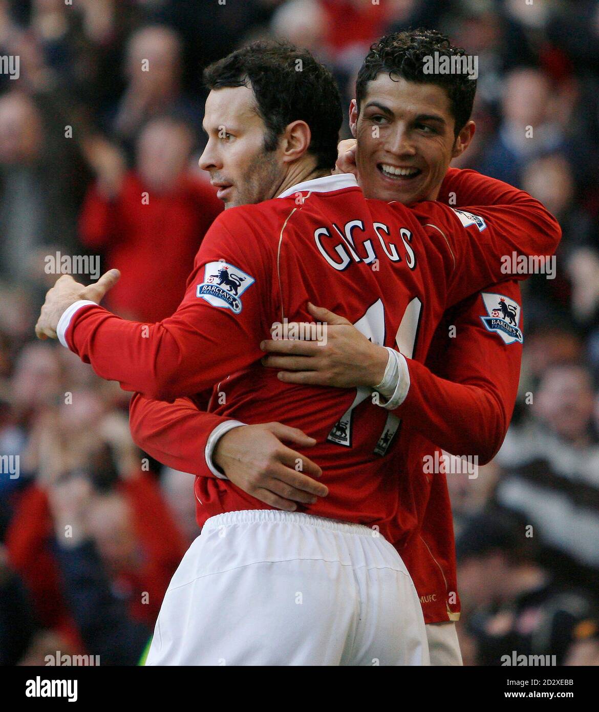Manchester United's Cristiano Ronaldo (R) celebrates his goal with Ryan  Giggs during their English Premier League soccer match against Manchester  City at Old Trafford in Manchester December 9, 2006. NO ONLINE/INTERNET USE