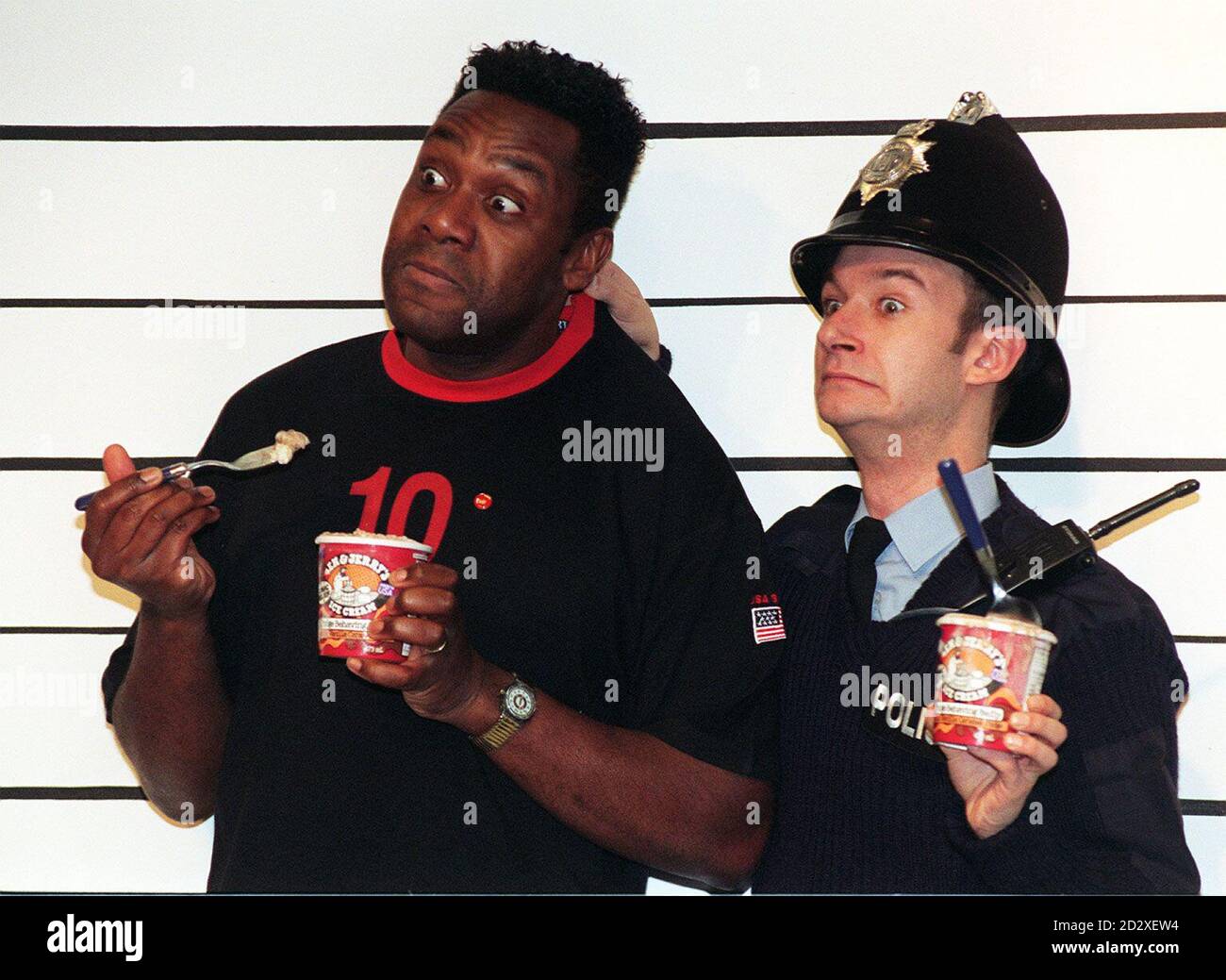 Comedian Lenny Henry has his collar felt by James Dreyfus (PC Goody in BBC  TV's The Thin Blue Line) during today's (Monday) launch of a new Comic  Relief flavour ice cream. At