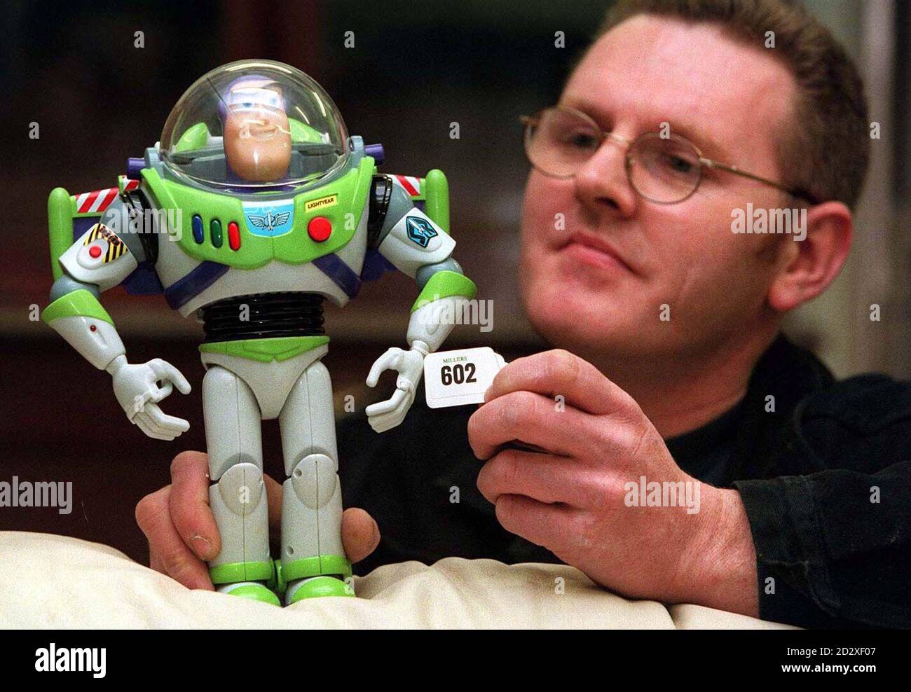 Harry Meers from Newcastle ,who today (mon) bought Buzz Lightyear, a character from the top feature film Toy Story. Mr Meer paid three times the normal selling price, paying  70 for the toy which is enjoying huge demand in the run-up to Christmas. Photo by Owen Humphreys/PA. Stock Photo