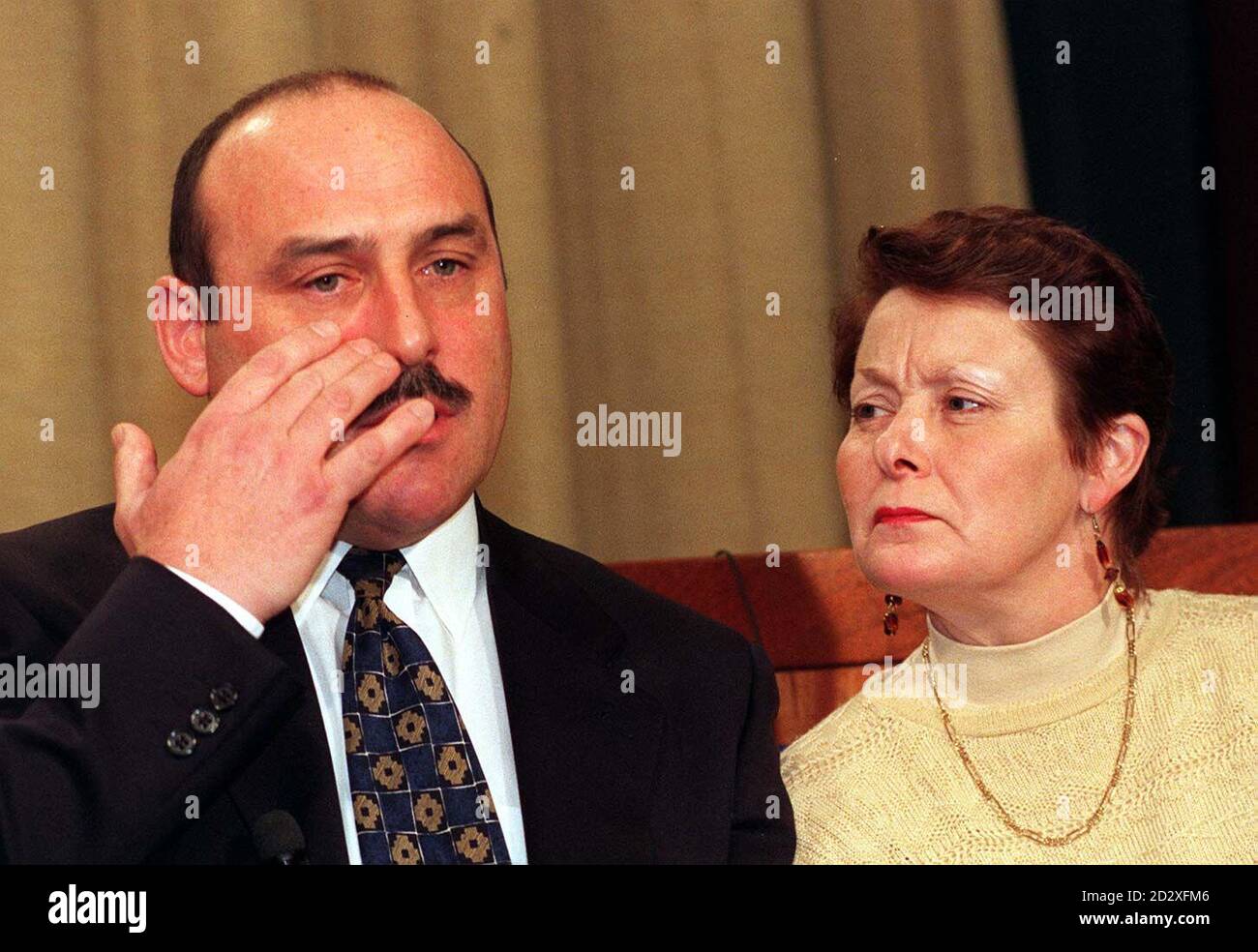 Heartbroken parents John and Maria Hitchens issue a plea to teenagers to turn their backs on drugs during a news conference in London today (fri) following the death of their son, suspected Ecstasy victim Robert.  Robert is thought to have taken Ecstasy before he collapsed early on New Year's Day at an all-night party in Heston, west London. The teenager, from Upminster, Essex, was taken to Ealing Hospital where he died later that afternoon. A post-mortem examination this morning was inconclusive. See PA story DEATH Ecstasy. Photo by David Cheskin/PA. (POOL). Stock Photo