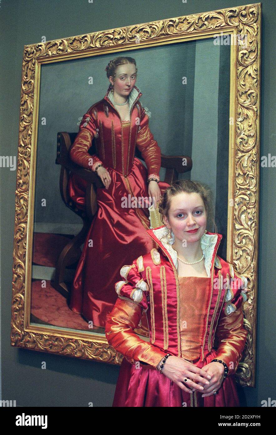 Hannah Sida models a costume interpretation based on Portrait of a Lady (La Dama in Rosso) by Giovanni Battista Moroni and designed by Charlie Copson, a student at Wimbledon School of Art. Design students chose to 'bring alive' 34 paintings on show at the National Gallery, for today's (Friday) costume parade. Photo by Fiona Hanson/PA Stock Photo