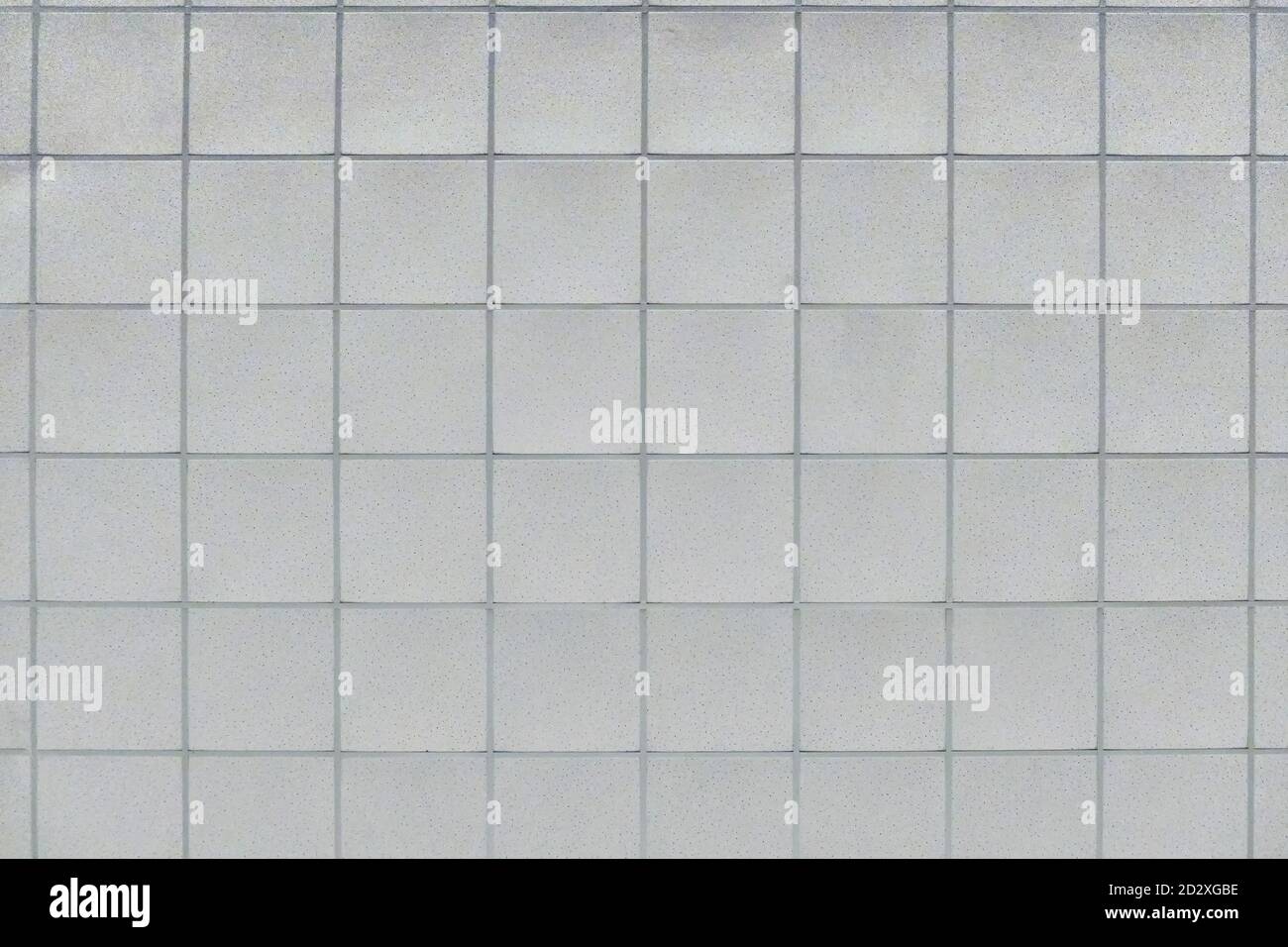 Background of the ceiling trim panels in the office. The texture of a standard panel ceiling in a building of flat squares. Stock Photo