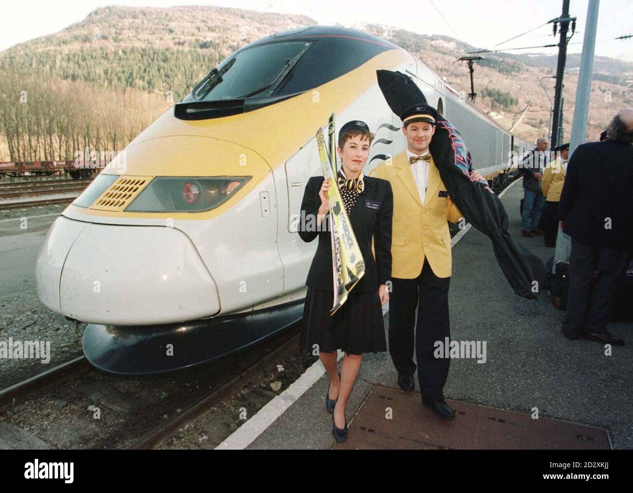 Eurostar cabin staff  Karen Willett, from Warwick, and George Russell, from London, help unload skis off the first direct Eurostar train from London to Saint Maurice in the French Alps, the new service which will start at the beginning of the 1997 ski season. Photo Tim Ockenden/PA See PA story TRANSPORT Eurostar. Stock Photo