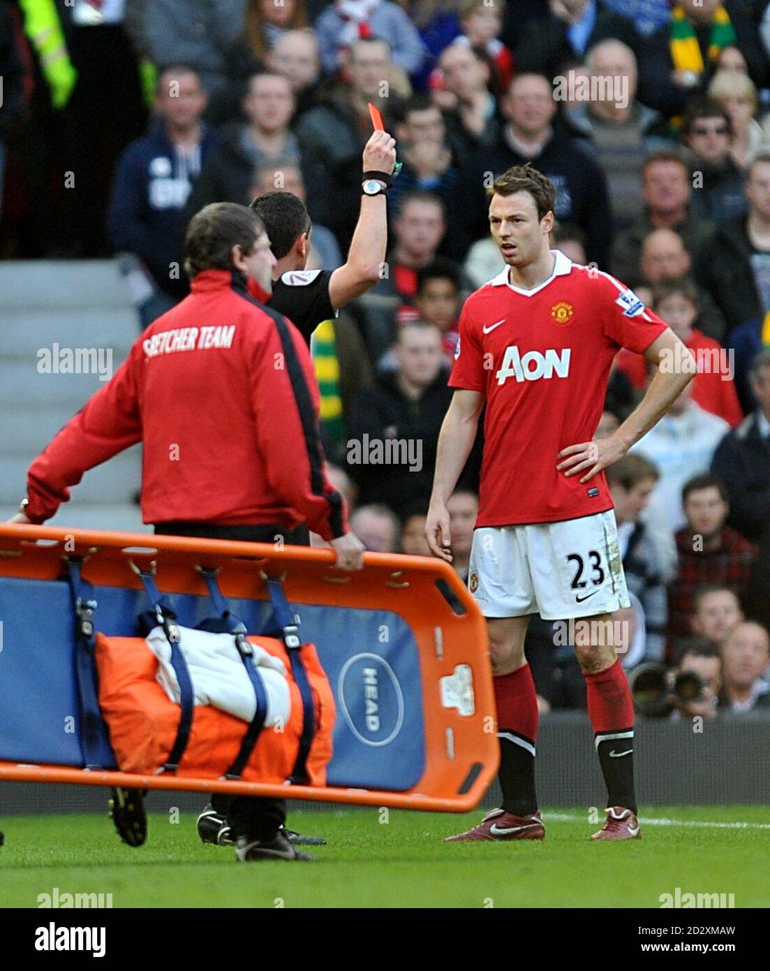 Referee Andre Marriner shows the red card to Manchester United's Jonny Evans Stock Photo