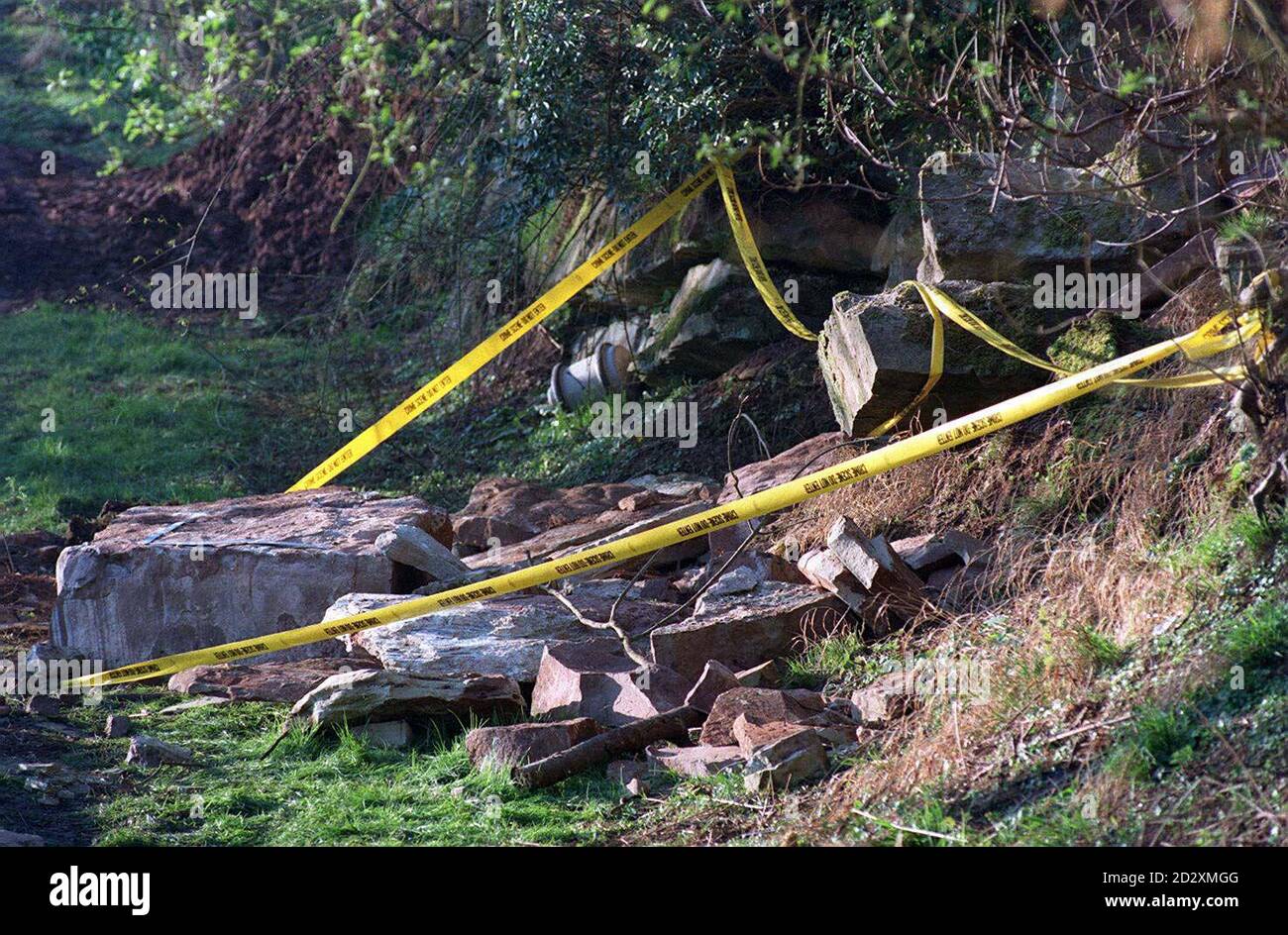 Police tape seals off the scene where Stuart Perkins and David Neil Weaver, the two scout leaders were crushed to death earlier today (Monday) when a rock escarpment fell on their tent. Fire chiefs said the rock face may have collapsed after being weakened by the heat from a camp fire. Marcus Hill ,a third leader, survived and escaped injury but suffered severe shock. See PA Story DEATH Scout. Stock Photo
