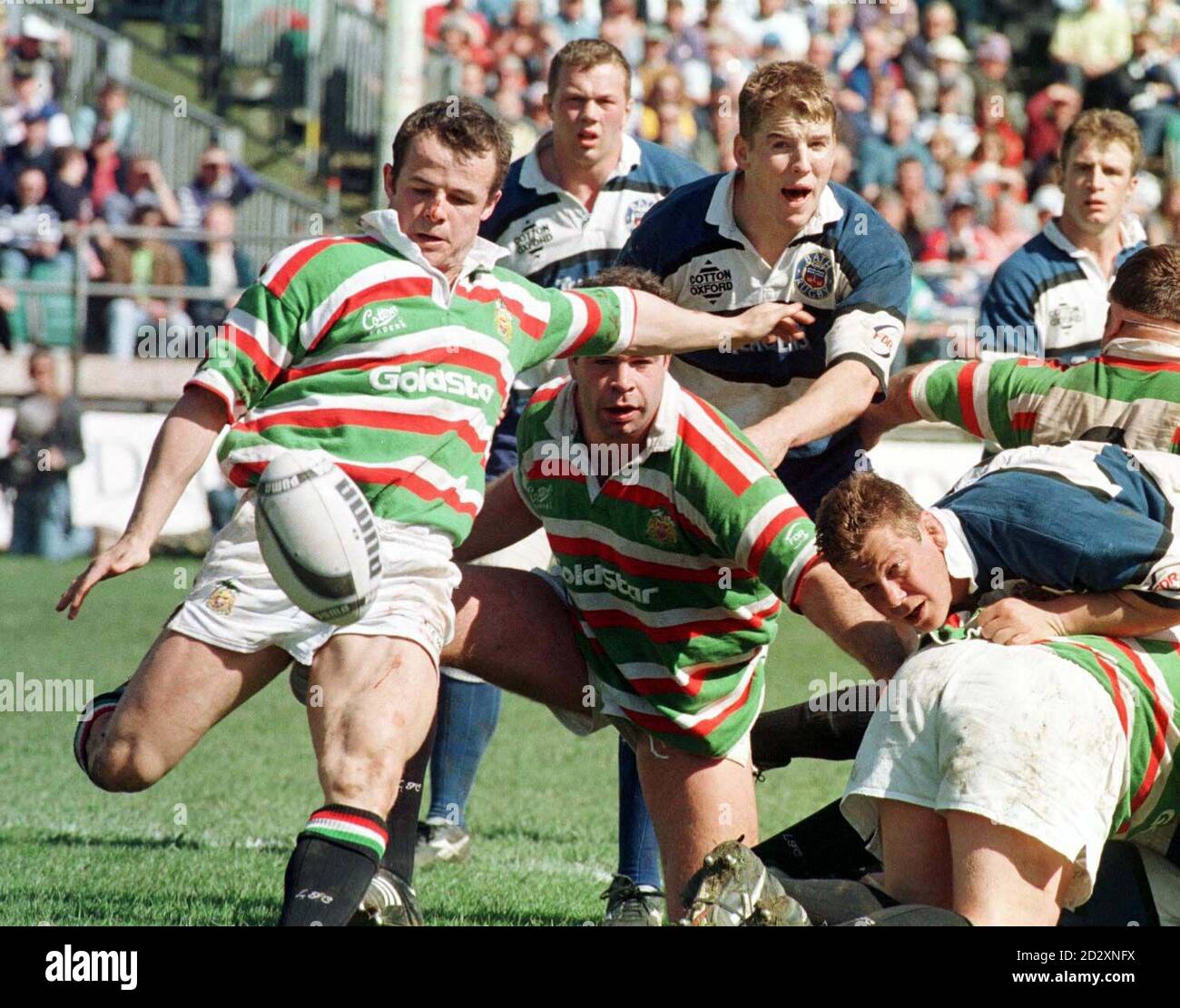 Austin Healey (Leicester) kicks clear from Bath's Dan Lyle (front standing) and Richard Webster (right crouched) during their Courage Clubs Championship match at Bath.   *  Reissued 15/2/99 (cropped) London Irish announced they have cited Leicester and England star Austin Healey for stamping. Their decision means that Healey will face a Rugby Football Union disciplinary hearing, and if found guilty, could receive a recommended 12-week ban. Stock Photo
