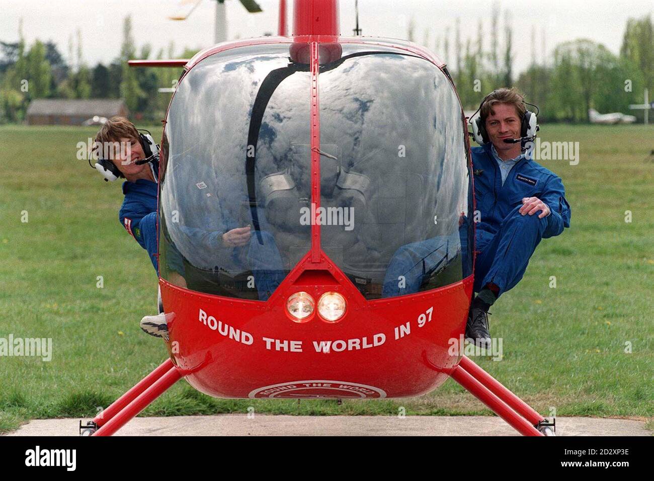 Jennifer Murray, a 56-year-old grandmother, is poised to fly into the record books as the first woman to pilot a helicopter around the world. This pioneering trip, which aims to raise 500,000 for Save The Children, takes off on May 10, 1997, from Denham, Middlesex, where Jennifer is pictured today with co-pilot Quentin Smith, 32. Photo by Sam Pearce. Stock Photo