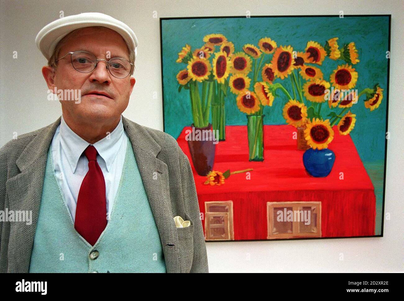 Artist David Hockney stands in front 30 SUNFLOWERS, one of the  paintings from his Flowers,  Faces and Spaces exhibition, which opened today (Thursday) at Annely Juda Fine Art. The Exhibition runs until July 19, 1997. Photo by Peter Jordan. Stock Photo