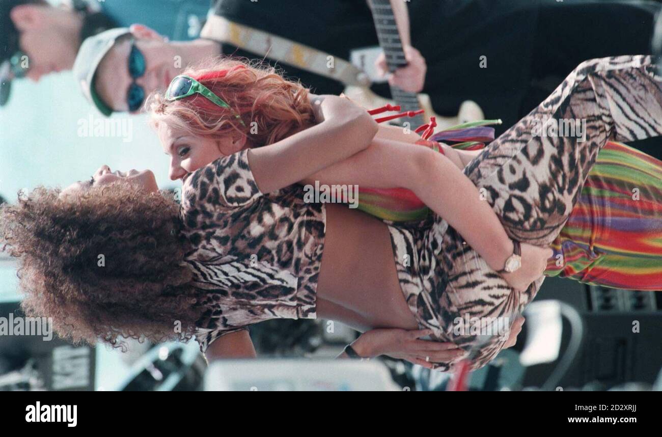 Spice Girl Mel B gets a lift from Ginger Spice Geri Halliwell during  rehearsals for tonight's concert, at the 50th Cannes Film Festival Stock  Photo - Alamy