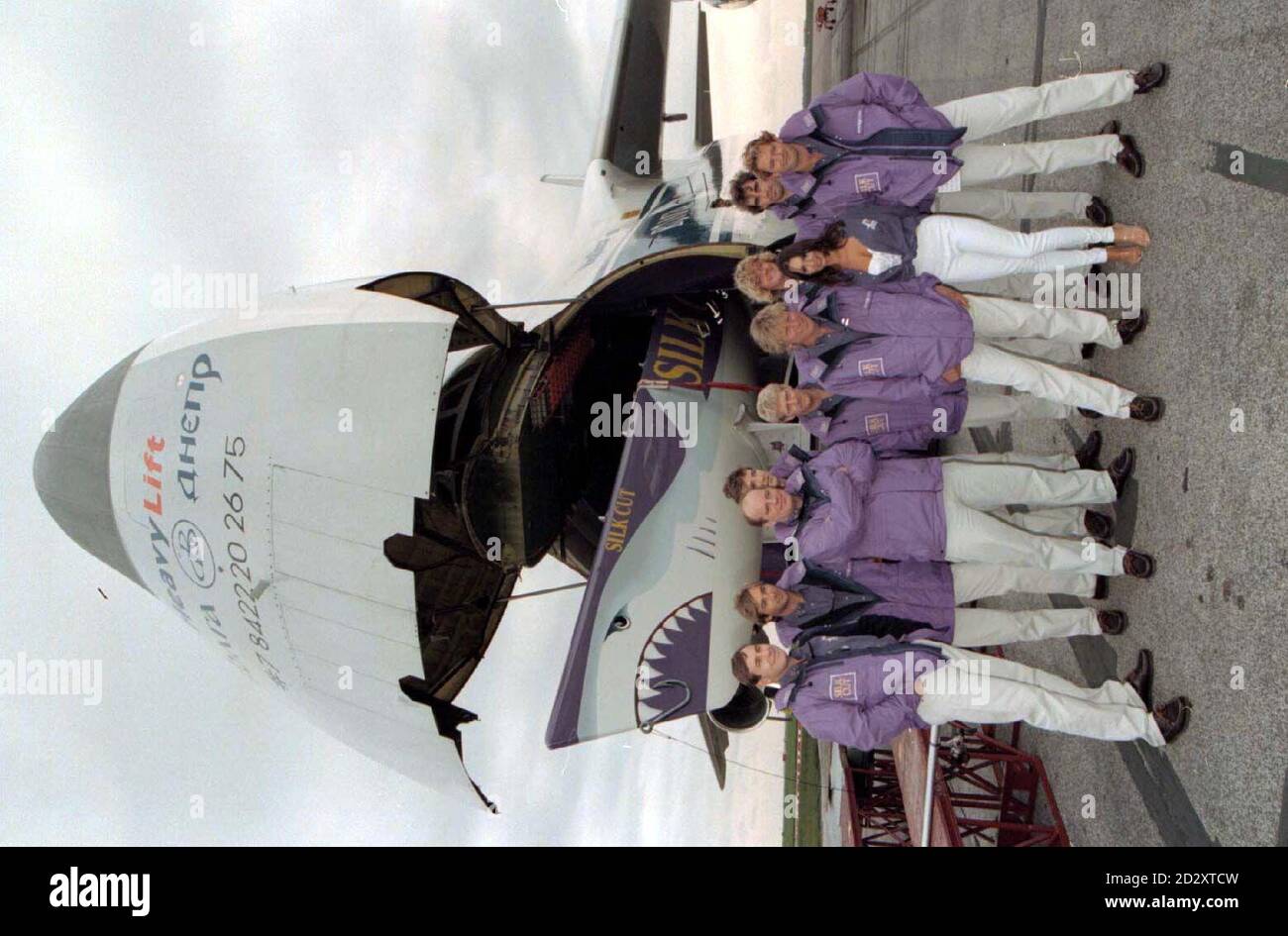 Former Page 3 model Kathy Lloyd helps Lawrie Smith (centre foreground) and his crew unload Silk Cut, the British entry in the 1997/8 Whitbread Round the World Yacht Race at  Stansted Airport today (Tuesday). Photo by Findlay Kember/PA Stock Photo
