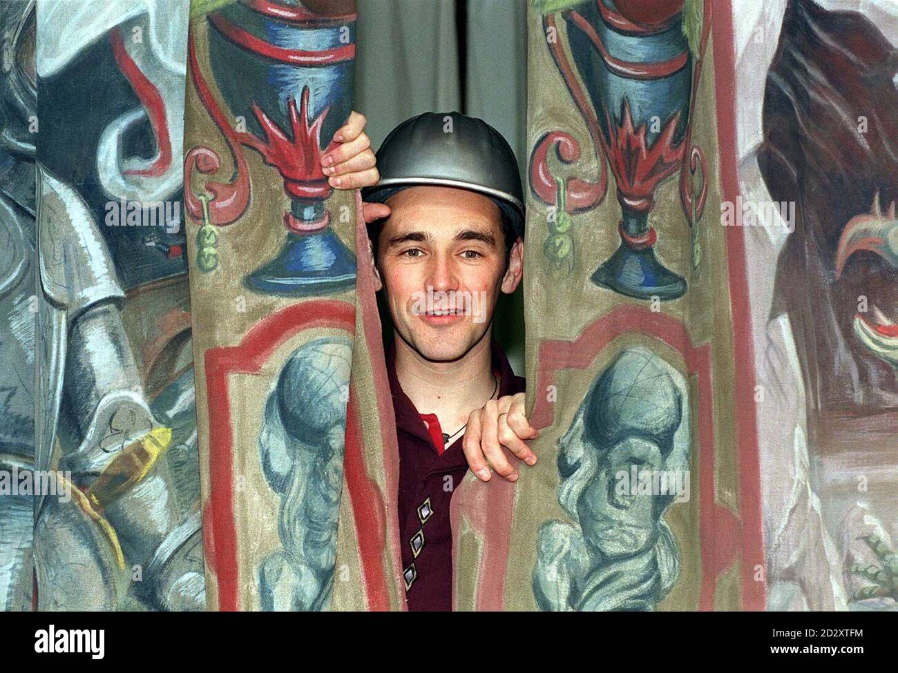 Artistic director Mark Rylance peers behind the Globe Theatre's curtain as he unveiled the newly-built playhouse stage, at the theatre today (Thursday). Built as closely as possible to original designs, the double-pillared stage has been painted in original pigments used in the 16th century.   *  20/10/99:  President Jiang Zemin visited the Globe Theatre despite Rylance writing a letter to the Foreign Office expressing concern of human rights abuse in China. Stock Photo