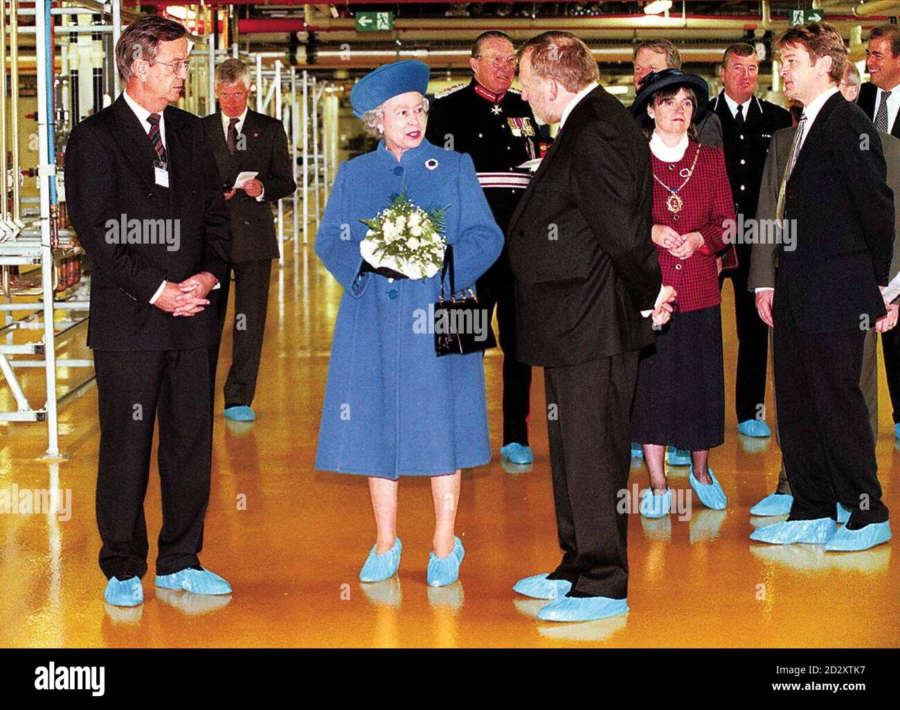 The Queen wears protective shoes to be shown around the new Siemens factory at Wallsend, North Tyneside today (Friday).  Her Majesty opened the huge microchip factory with an historical official ceremony transmitted via the Internet throughout the world.  It is believed this is the first time the Queen has gone live in sight and sound.  See PA story ROYAL Factory. WPA ROTA Photo by Owen Humphreys/PA. Stock Photo