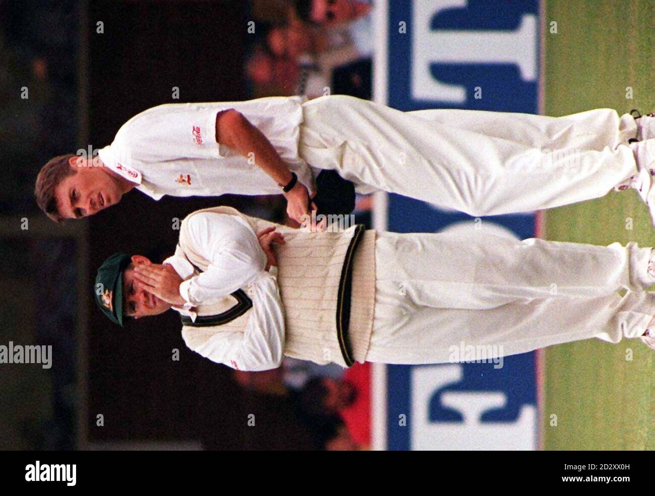 No answers seem to spring to mind as Australian Captain Mark Taylor (left) ponders on how to stop England increasing their advantage over his side with bowler Glenn McGrath as England increase their lead in the First Test Match at Edgbaston today(Sat). Photo John Giles/PA. Stock Photo