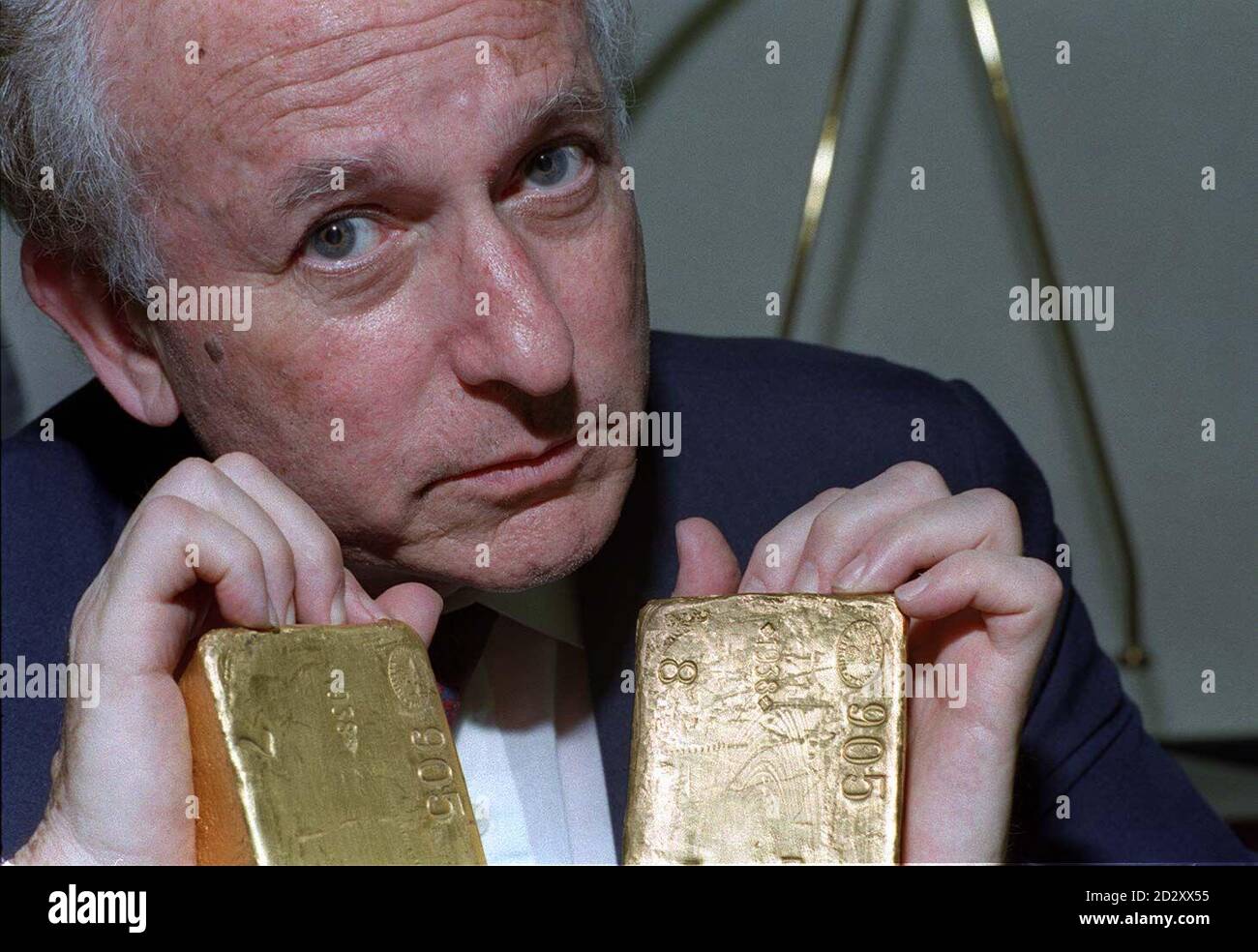 Holocaust Educational Trust chairman and former Labour MP Greville Janner QC, with the Nazi gold bars which could contain gold stolen from the bodies of Jewish Holocaust victims, at the Bank of England today (Tuesday),  before they were displayed publicly for the first time. See PA Story SOCIAL Nazi. Stock Photo