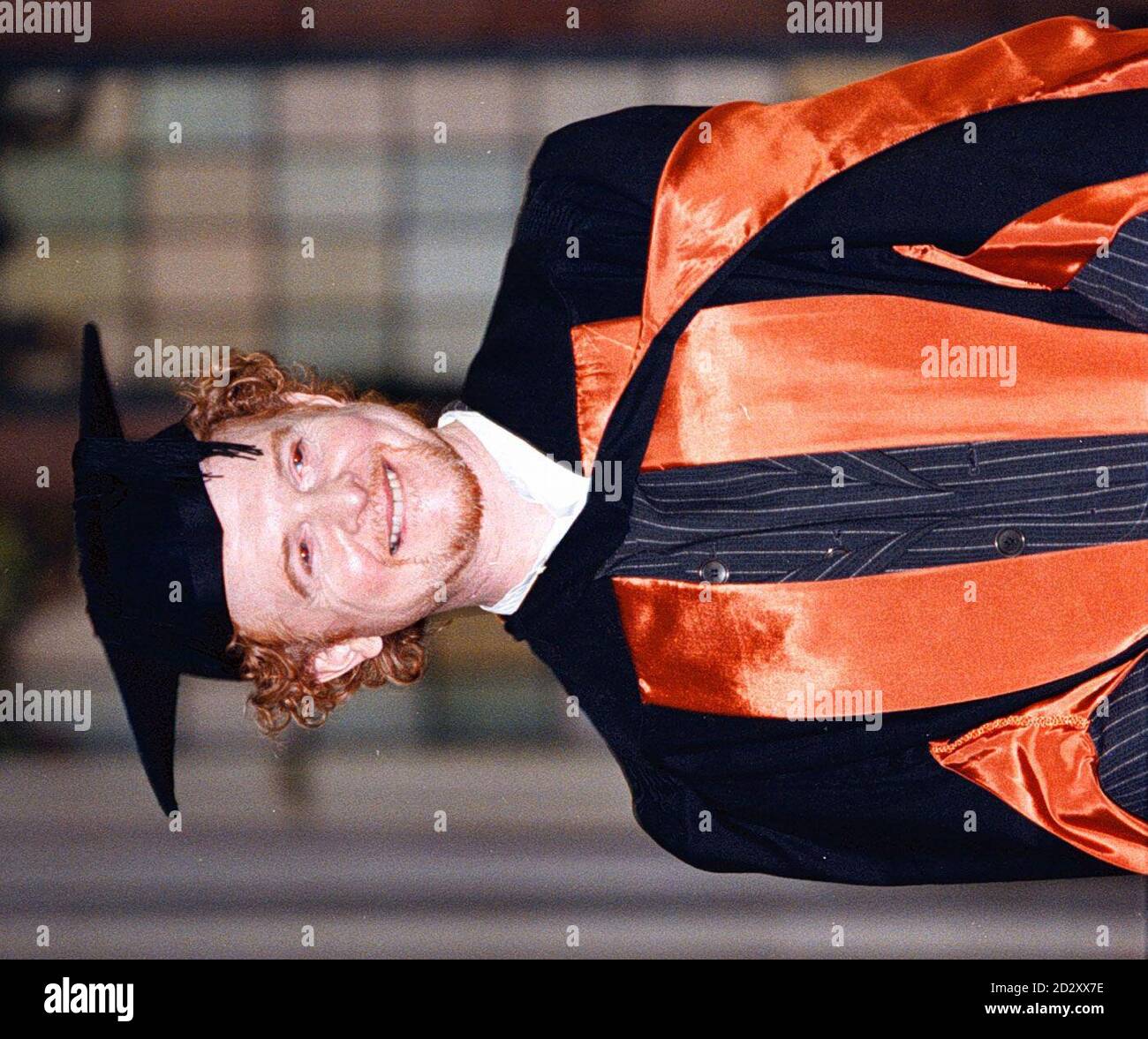 Simply Red lead singer Mick Hucknall, after collecting an honorary degree from the University of Manchester Institute of Science and Technology , in a ceremony held in  the Universitys Great Hall today (Weds). Pic Dave Kendall. See PA Story SHOWBIZ Hucknall. Stock Photo