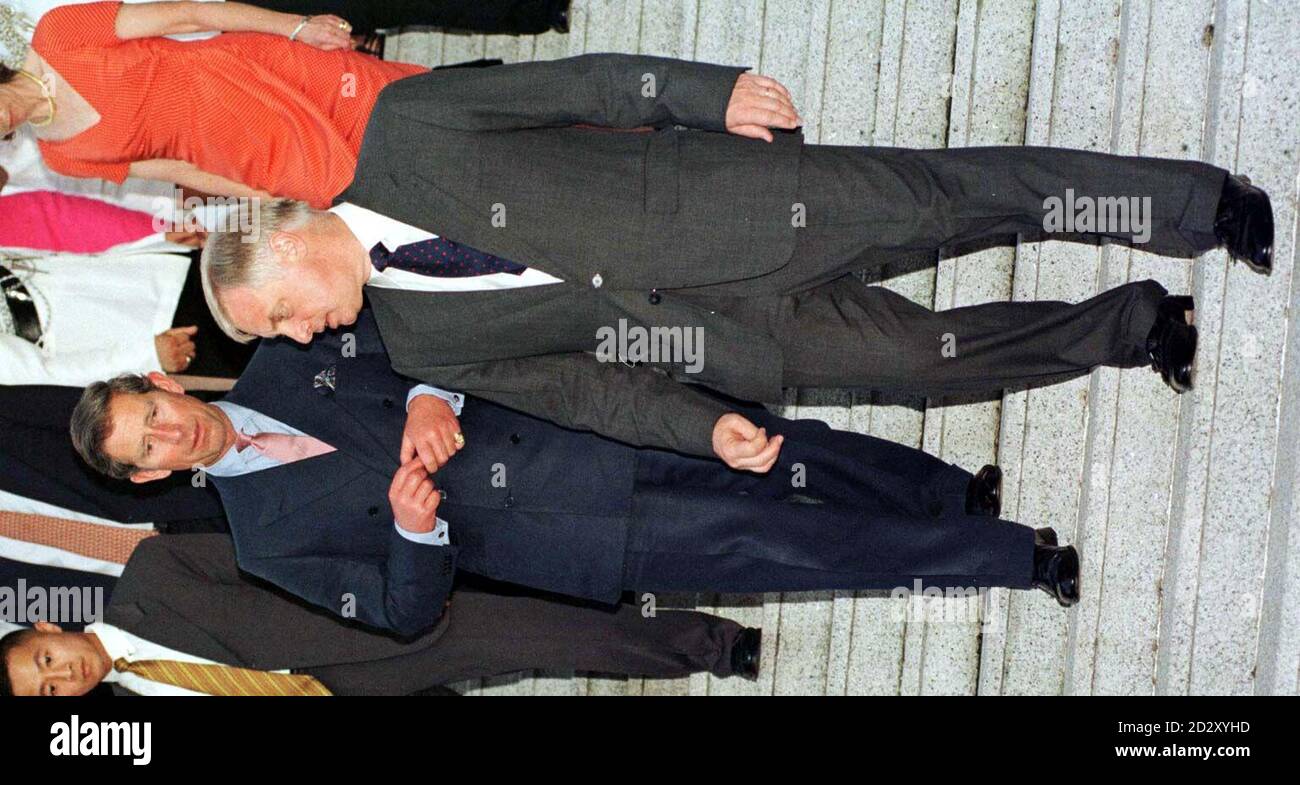 The Prince of Wales and the last Governor of Hong Kong, Chris Patten, make their way down the steps to the garden of Mr Patten's Hong Kong residence this evening (Saturday).  The Prince headed a list of almost 600 dignitaries  invited to the last reception ever to be held by a British governor at his official residence.  See PA story DIPLOMATIC Hong Kong. POOL PHOTOGRAPH BY JOHN STILLWELL/PA. Stock Photo