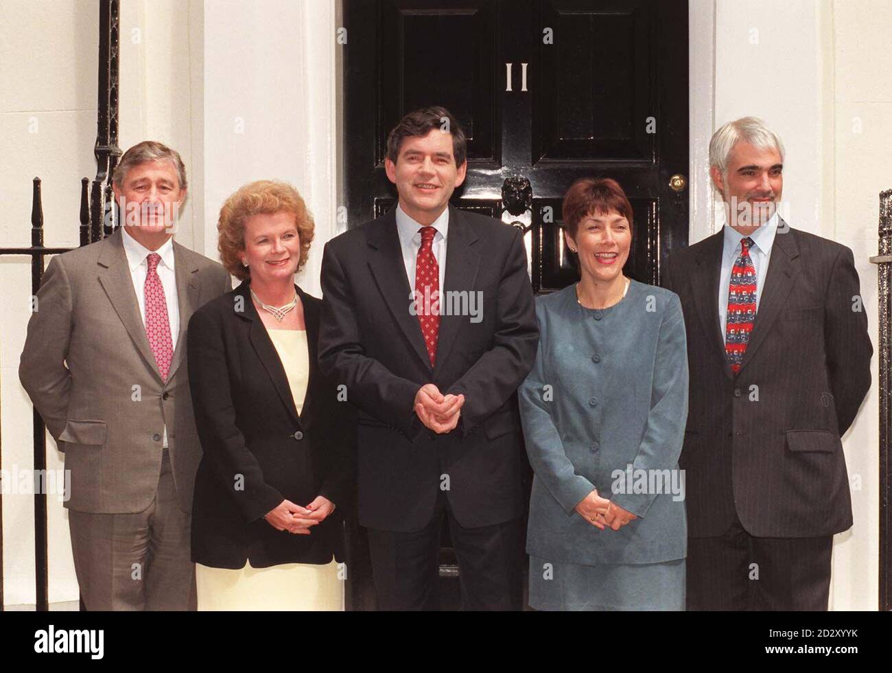 From left to right: Geoffrey Robinson, Paymaster General; Helen Liddell, Economic Secretary; Gordon Brown, Chancellor of the Exchequer; Dawn Primaralo, Financial Secretary and Alistair Darling, Chief Secretary. The full team of Treasury Ministers outside No.11 Downing Street today (Tues) where they revealed the government's new way to bring the Budget to ordinary people. Everyone will be given the chance to receive understandable information on the chancellor's economic policies by sending a request to the Treasury for the Budget 'made easy' style guide. Mr Brown will deliver the first Labou Stock Photo