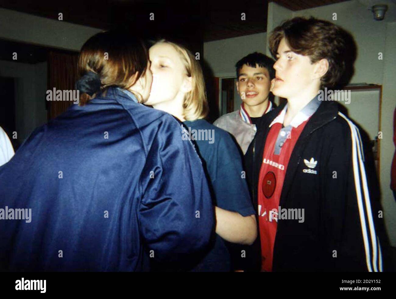 One of the last pictures taken of the tragic pupils from St James's School, Farnworth, who died in a coach crash in the French Alps last week. (L-R) Laura England (who survived), Nicola Moore, Keith Ridding and Robert Boardman. The girls are taking part in a party game involving passing a playing card using your teeth, whilst the boys look on on the first night of their school trip. Robert and Keith will be buried side by side today (Thursday) at a Manchester Church, whilst Nicola's funeral is expected to take place on Friday. PA. SEE PA STORY FUNERAL Alps. Stock Photo