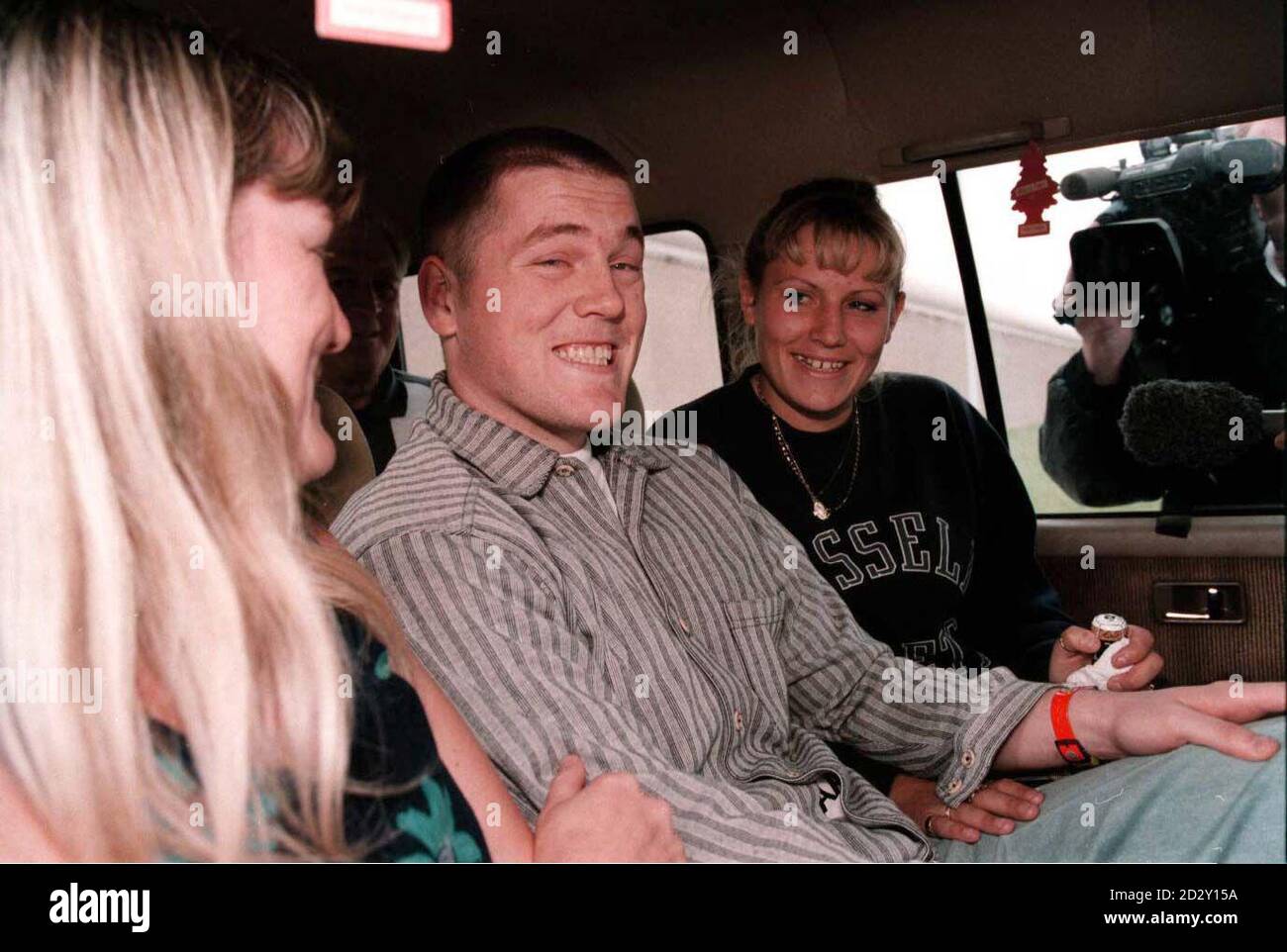 Teenager Philip English, convicted of stabbing a policeman despite being 100 yards away in handcuffs, smiles as he leaves Moorlands Prison, near Doncaster, this evening (Thursday) after having his conviction quashed by the House of Lords. Photo by Phil Callaghan/PA. SEE PA STORY COURTS English. **Women un-identified** Stock Photo