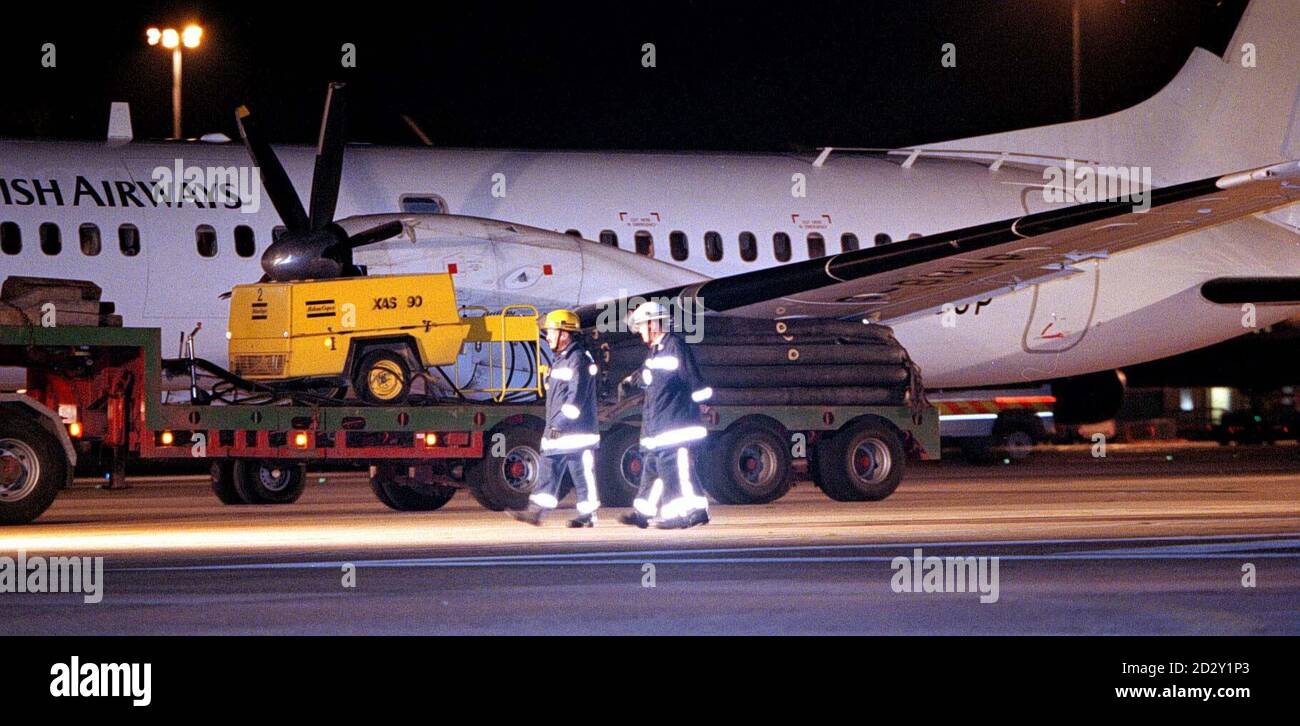 The failed port side undercarriage of the The British Aerospace ATP (Advanced Turbo-Prop) plane is mounted on a special airbed trailer as it is towed from the runway at Manchester Airport tonight (Sunday). POOL Photo by Dave Kendall/PA. See PA Story AIR Emergency Stock Photo