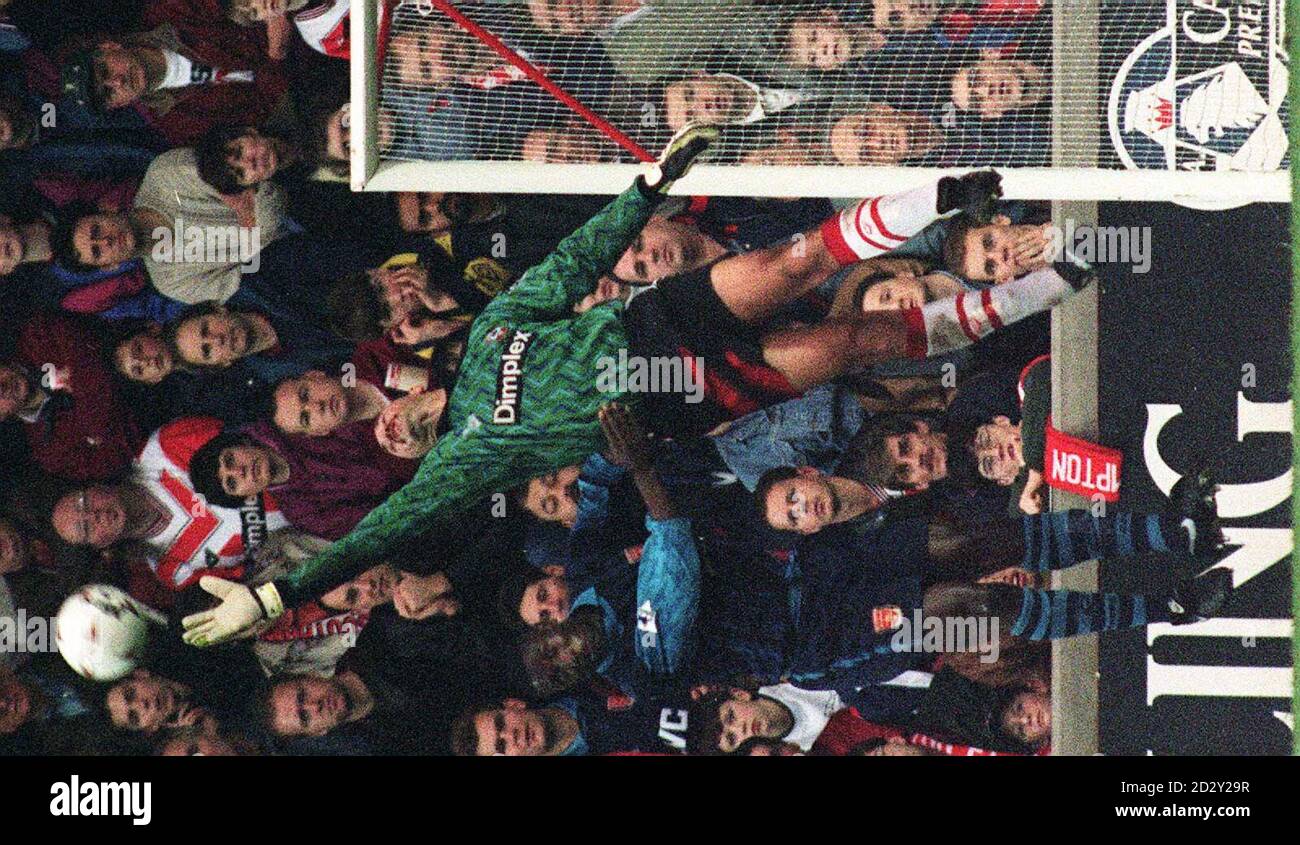 Library fiekr 260022-21 dated 19.11.94 of Southampton goalkeeper Bruce Grobbelaar as he flicks the ball away to safety from Arsenal's Kevin Campbell during their Premier League match at the Dell. Mr Grobbelaar was today (Friday) cleared of all charges in the match fixing trial at Winchester Crown Court. See PA Story COURTS Grobbelaar Stock Photo