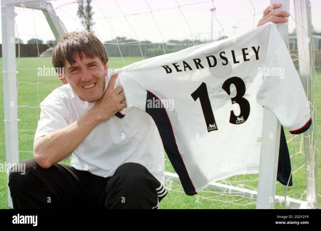 Former England star Peter Beardsley shows off his new number 13 strip
