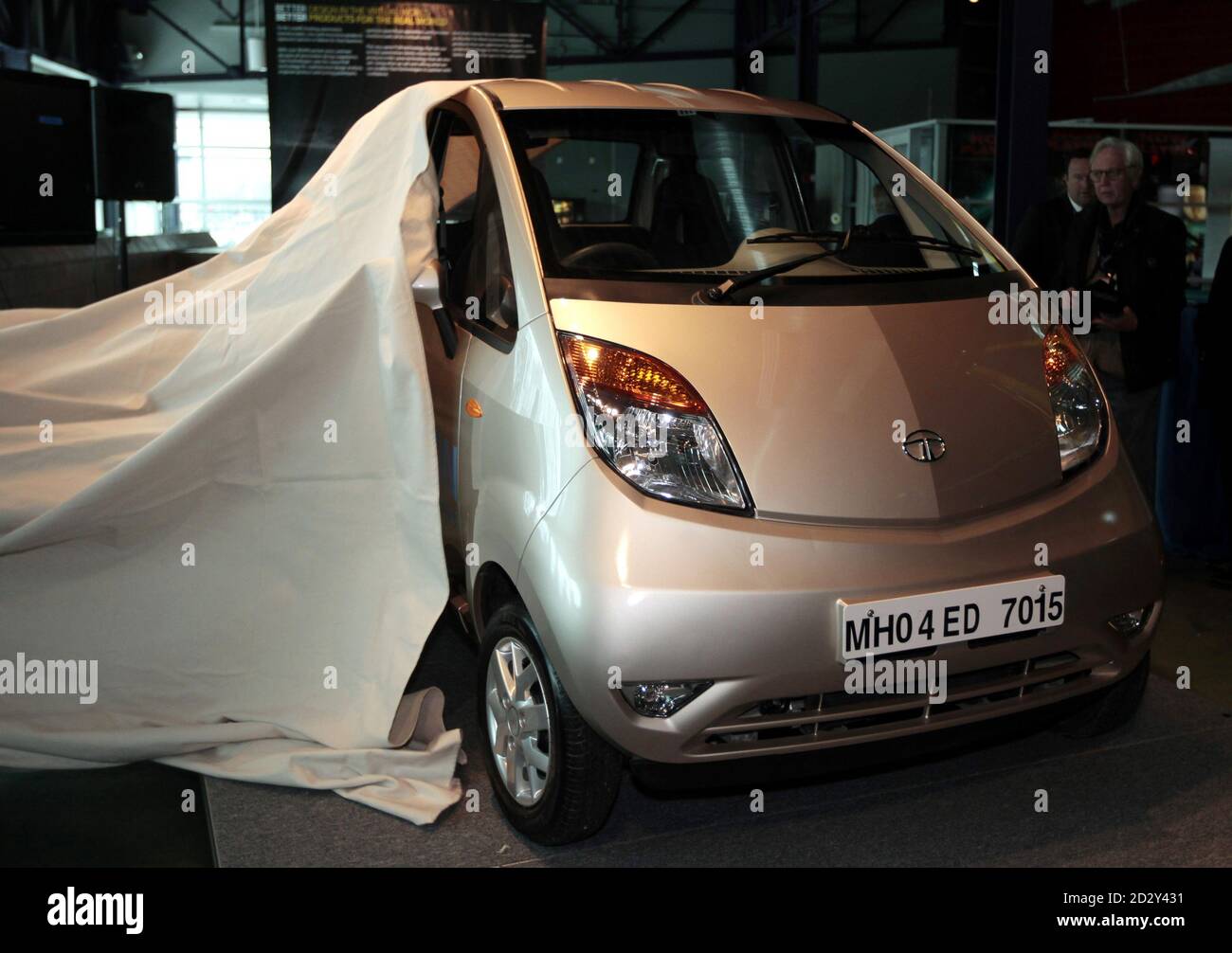 Tata Technologies unveils the Tata Nano vehicle as it is displayed for the first time in the U.S. at the Science Center in  Detroit, Michigan January 14, 2010. Unveiled last year in India by Tata Motors, the Tata Nano is targeted to families who have not previously been able to afford a car. REUTERS/Rebecca Cook  (UNITED STATES - Tags: TRANSPORT BUSINESS) Stock Photo