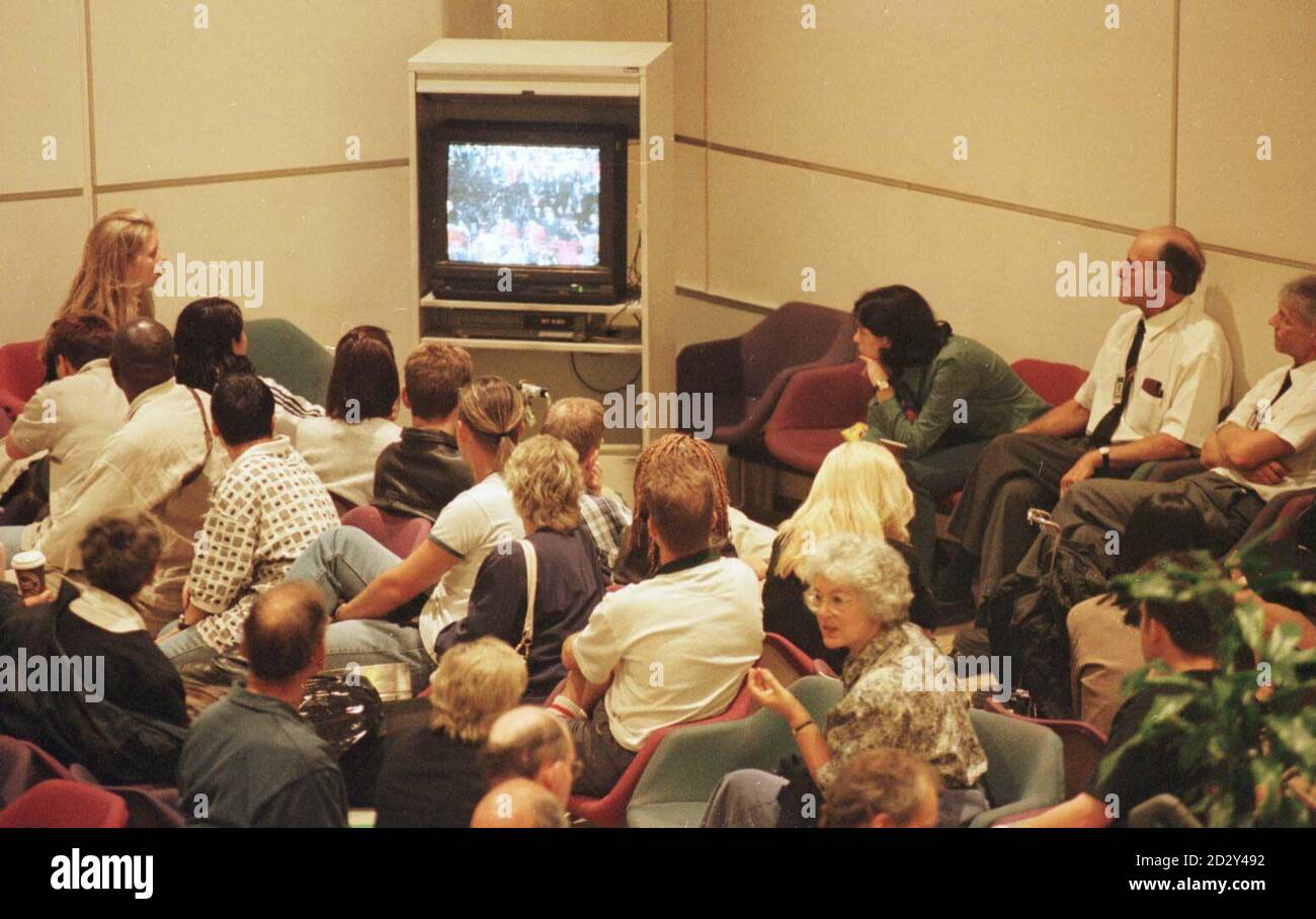 Passingers watch Diana's funeral on television at Heathrow's Terminal One before the 2 minutes silence at 11 o'clock. Photo by Stock Photo