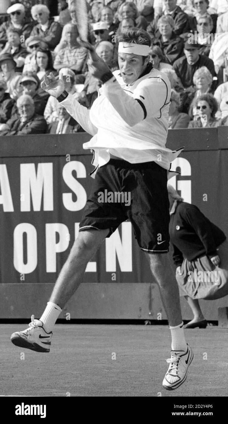 Britain's Greg Rusedski in action against Argentinian Lucas Arnold in the Samsung International in Bournemouth today (Friday). Rusedski will reach a semi-final for the fourth tournament in succession if he wins this afternoon.  See PA story TENNIS Rusedski.  Photo by Tim Ockenden/PA Stock Photo