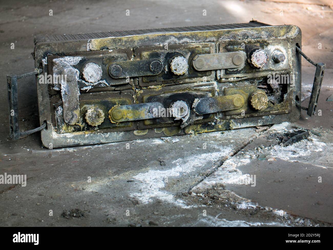 leaked car battery environmental destruction Stock Photo