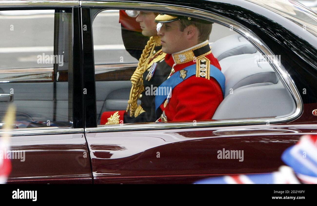 Prince William along with his brother Prince Harry salute as they travel down Whitehall in London en route to Westminster Abbey for the royal wedding. Stock Photo