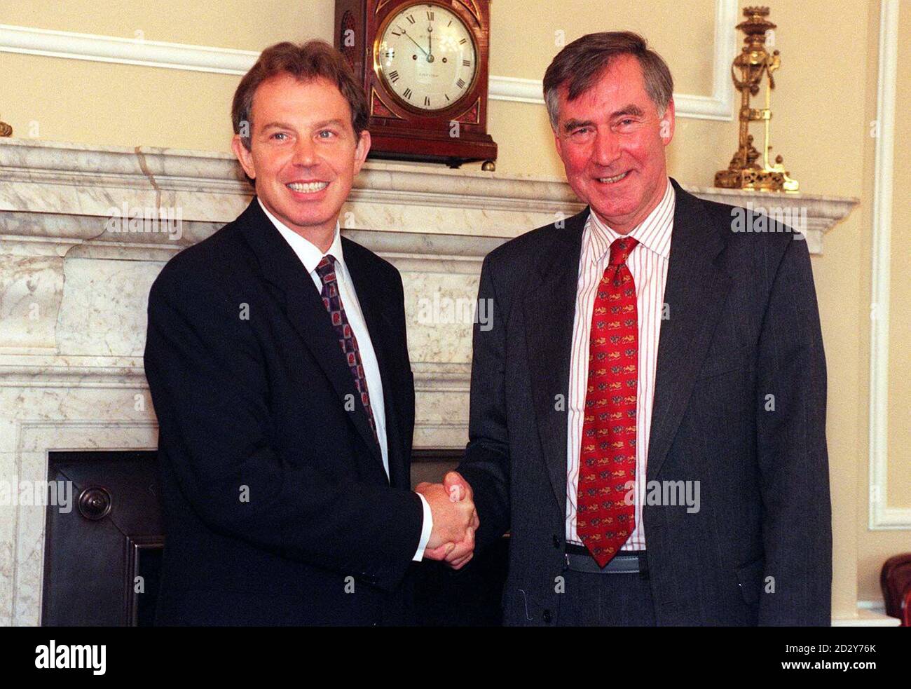 Prime Minister, Tony Blair, in the Cabinet Office at Number 10, today (Tuesday), shakes hands with Eric Anderson, Rector of Lincoln College, Oxford who was Blair's favourite teacher at Fettes School, Edinburgh.   Stock Photo