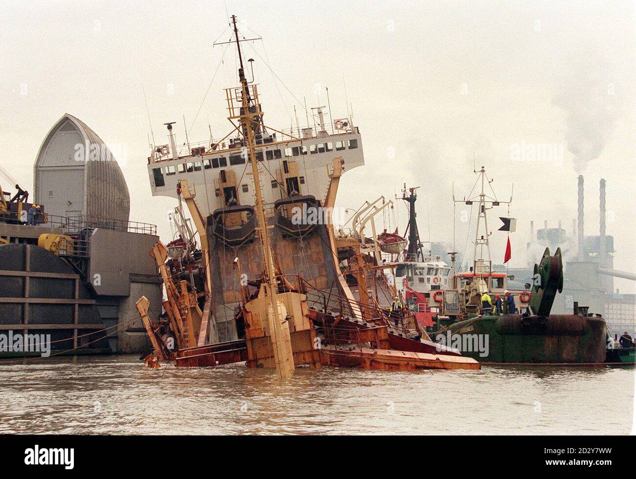 The hull of the 98-metre long ship nose down in the water with its stern in the air, after the vessel crashed into the Thames Barrier in dense fog early this morning (Monday) and sank in shallow water.  No one was injured in the crash and 10 crew members were taken to shore when the Sand Kite collided with the barrier in thick fog at 6.50am. See PA Story ACCIDENT Ship. Photo by David Giles. Stock Photo