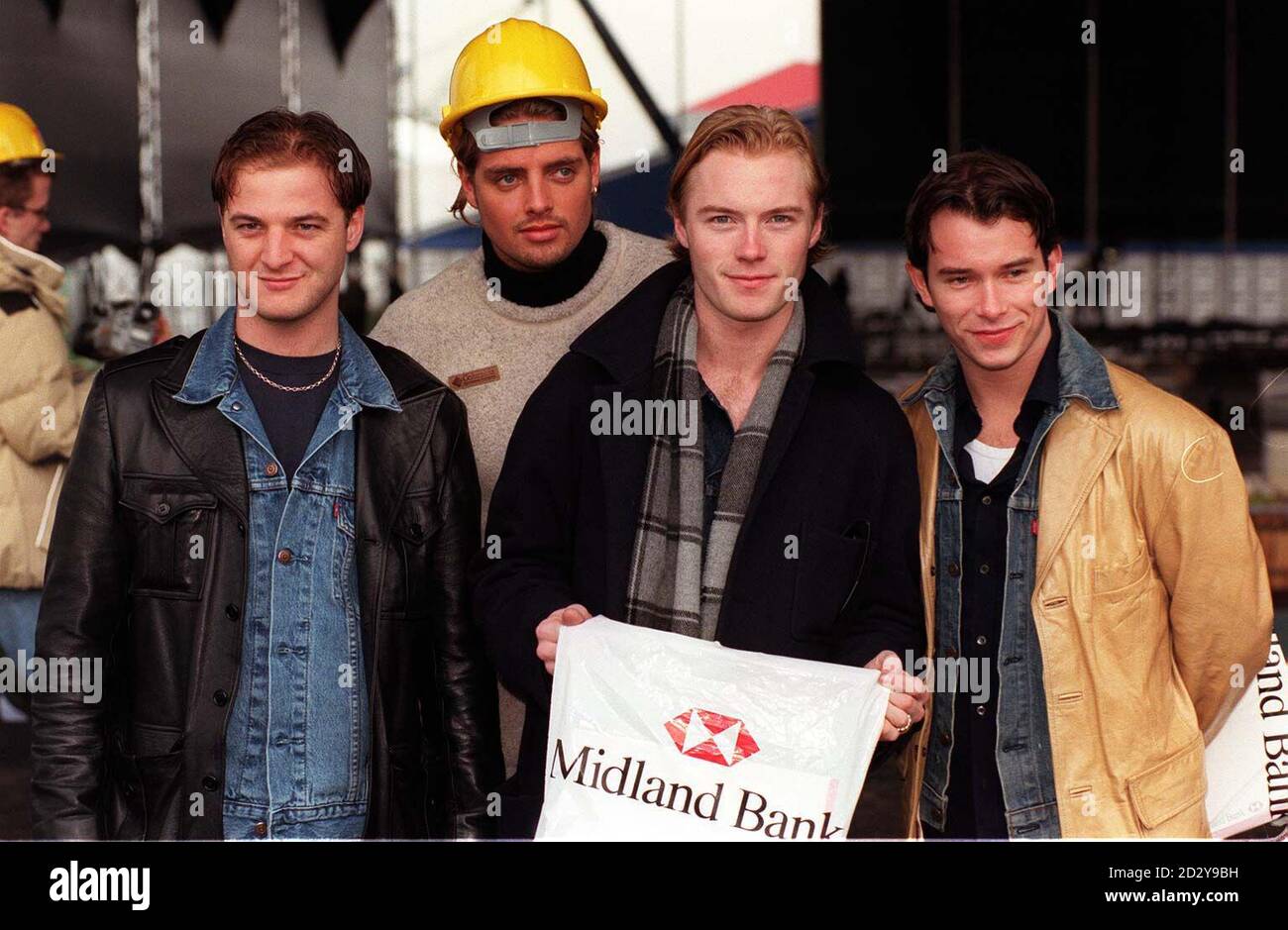 Irish band, Boyzone, join the 'Hard Hat Party' at the Battersea Power Station site in London today (Thursday) to launch the Midland '97 concert series.  The boy band are amoung the big names due to peform when the cult landmark plays host to a three-week indoor festival of entertainment, arts and leisure this December. From left to right: Mikey Graham, Keith Duffy, Ronan Keiting and Stephen Gately. Photo by Peter Jordan/PA Stock Photo