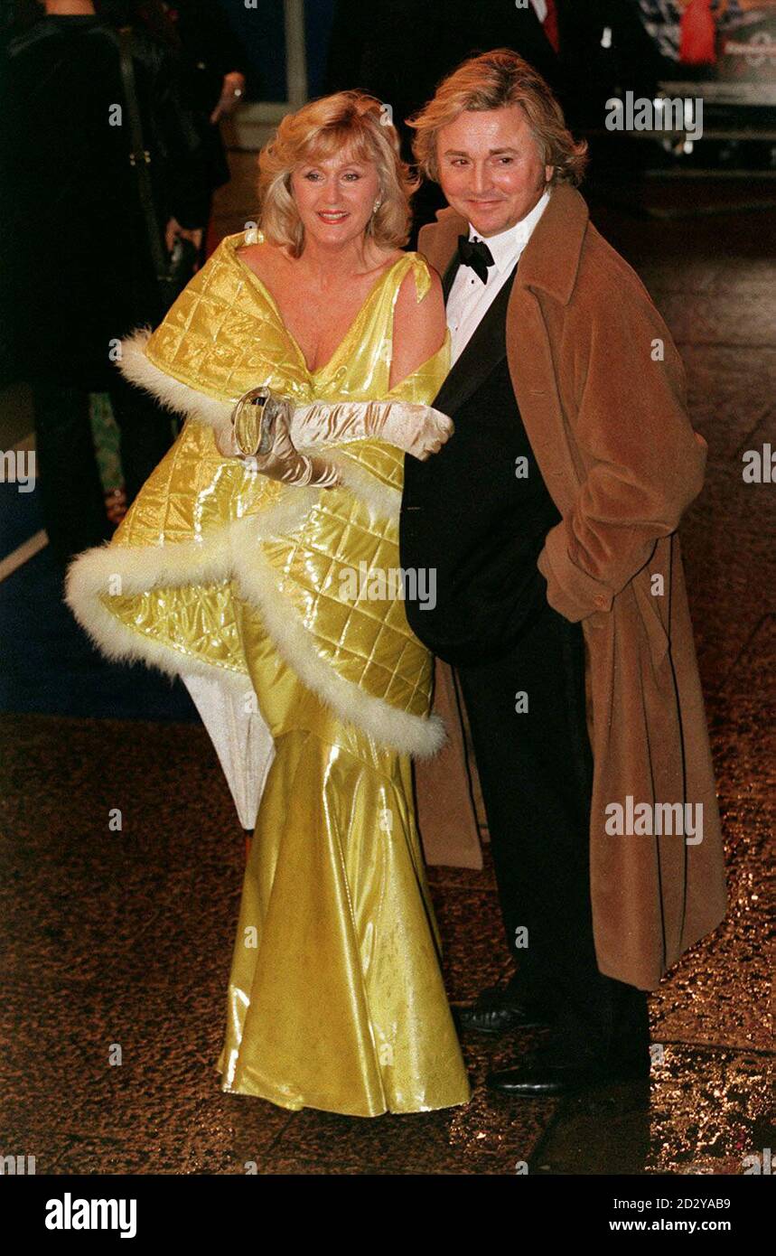 PA NEWS PHOTO 9/12/97 FASHION DESIGNER DAVID EMANUEL AND LIZ BREWER ARRIVE AT THE WORLD GALA PREMIERE OF THE NEW JAMES BOND MOVIE 'TOMORROW NEVER DIES' AT THE ODEON CINEMA IN LEICESTER SQUARE, LONDON Stock Photo