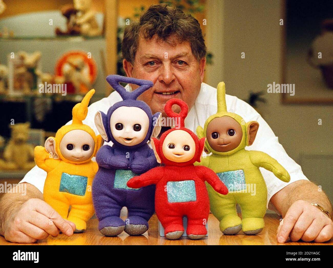 John Hales, chairman of toymakers Golden Bear Products, with Teletubbies in his factory showroom. Hales's plant in Telford, Shropshire cannot manufacture them quickly enough to satisfy overwhelming demand for Tinky Winky, Dipsy, Laa-Laa and Po. His company is shipping out 100,000 pieces a week and by Christmas Day over 1.2 million will have been sent out to the shops.See PA story RACING Hales. Photo by Rui Vieira/PA Stock Photo