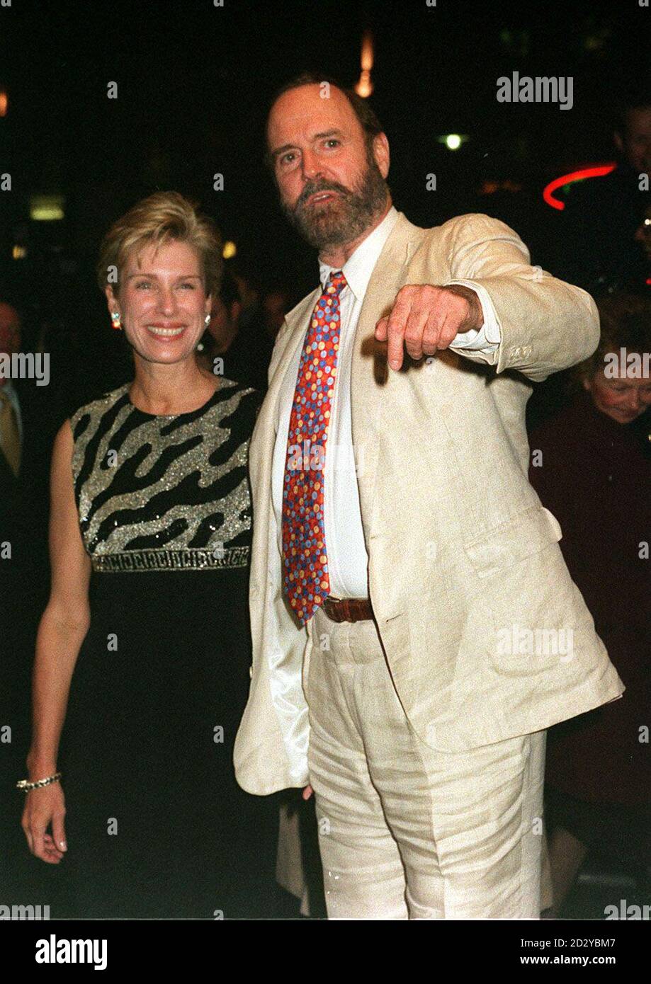 PA NEWS PHOTO 28/01/97 JOHN CLEESE ACCOMPANIED BY HIS WIFE ALYCE FAYE EICHELBERGER ARRIVING AT THE EMPIRE, LEICESTER SQUARE, LONDON FOR THE EUROPEAN GALA CHARITY PREMIERE OF  "FIERCE CREATURES" Stock Photo