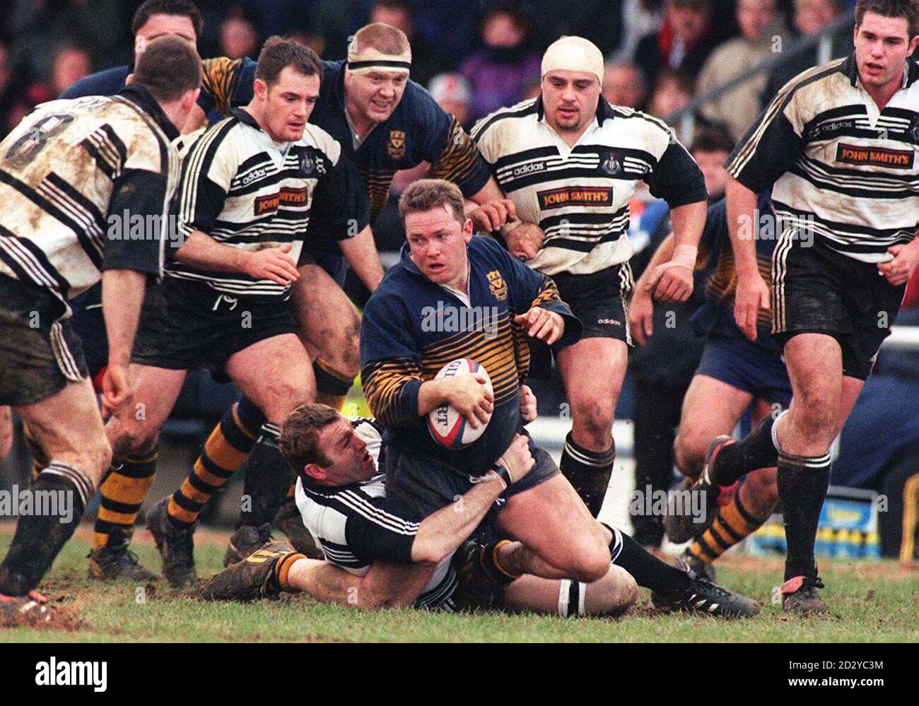 Worcester Gary Clarke looks for support as he is tackled by Newcastle defenders during today's Tetley Bitter cup match at Worcester. Newcastle won a close match by 10 points to 0. Picture DAVID JONES/PA Stock Photo