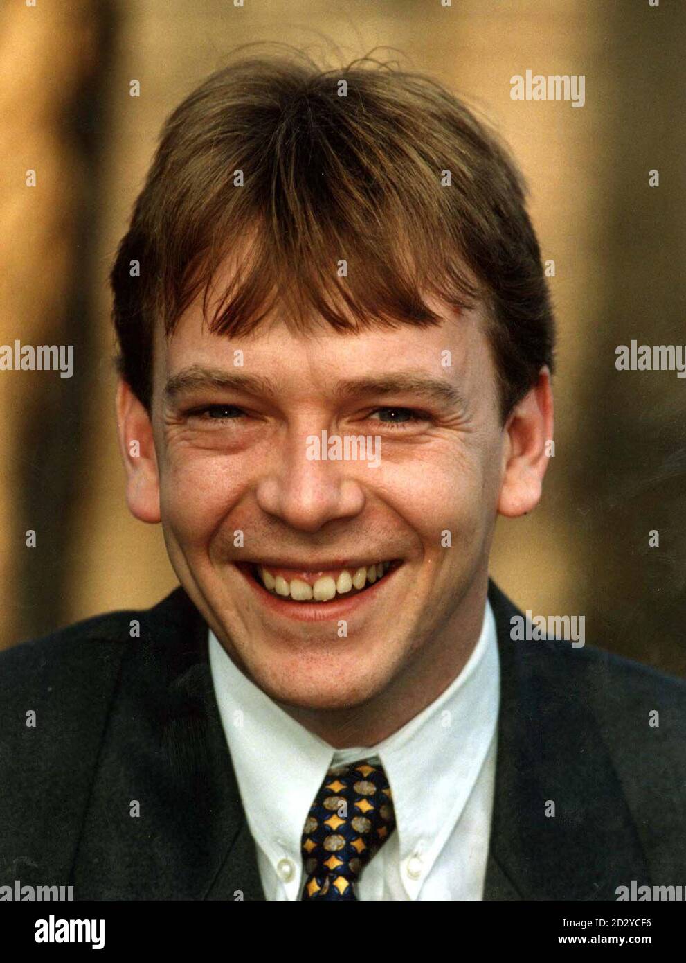 PA NEWS PHOTO 26/01/98 BBC TV 'EASTENDERS' ACTOR IAN BILL (ADAM WOODYATT) AT A PHOTOCALL TO CELEBRATE THE 100TH I.T. FOR ALL CENTRE IN WOOD GREEN CENTRAL LIBRARY, LONDON Stock Photo